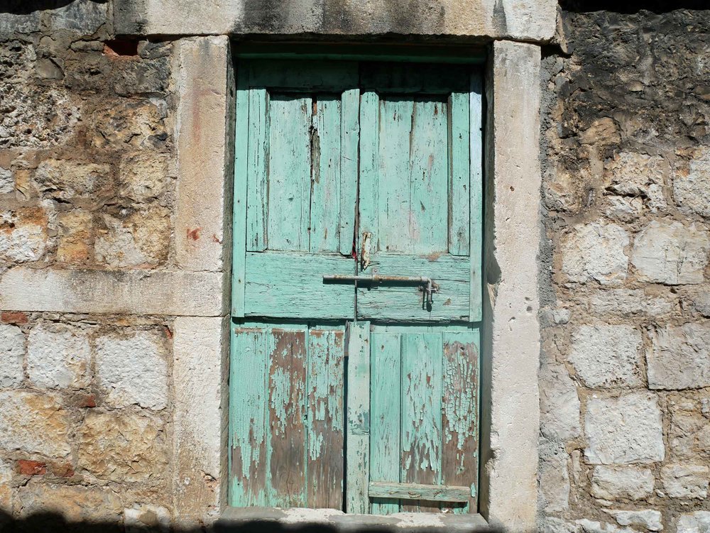  Doors and shutters throughout the village were painted a pale sea-foam green, which we adored.&nbsp;&nbsp; 
