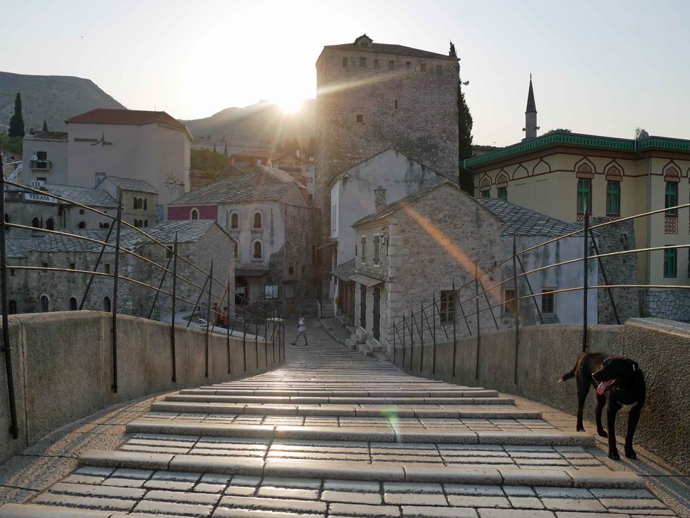  Walking the steeply curved Stari Most (Old Bridge), a medieval arched bridge from which the town Mostar gets it's name.&nbsp; 