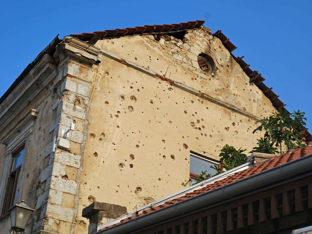  The realities of war were a present reminder throughout ravaged Mostar with marks of bullets on many of the town's buildings.&nbsp; 