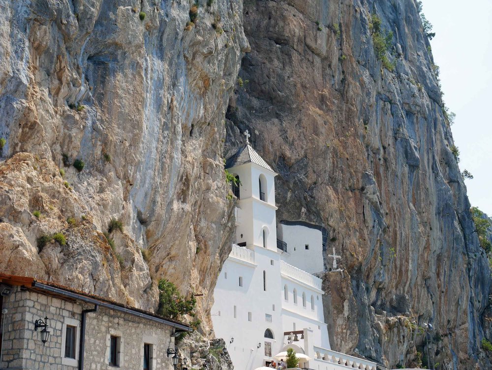  Many locals make the holy pilgrimage up the many stairs and steep trails to Ostrog Monastery, which has been built into a near vertical cliff (Aug 9).&nbsp;&nbsp; 