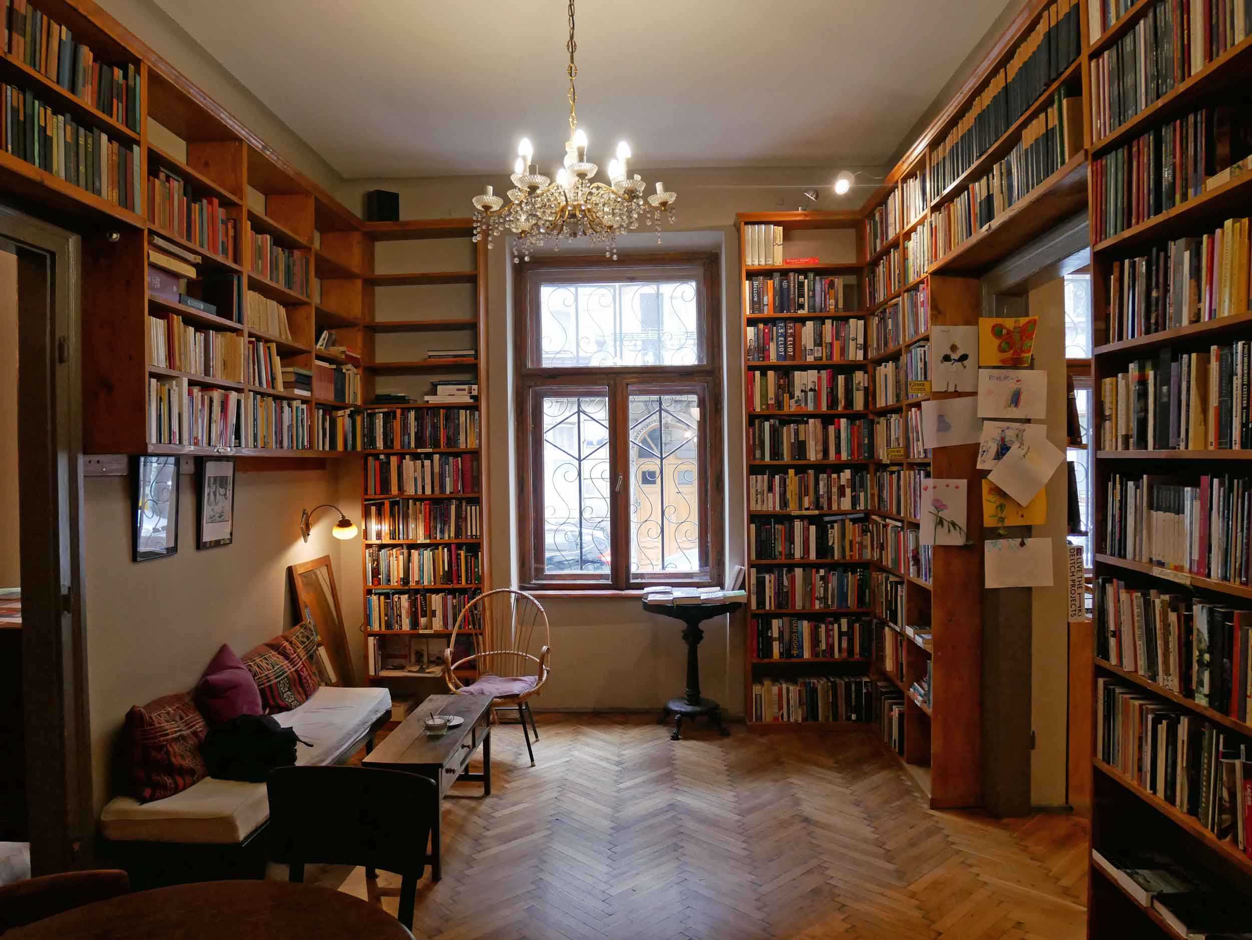  Such a warm and inviting space, customers browse the shelves and read books or periodicals in the café or in the furnished back rooms of Massolit. 