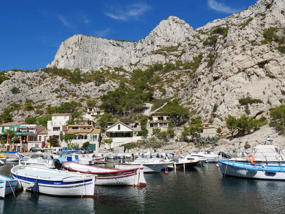  A  calanque  is a steep-sided valley formed within karstic regions either by erosion or the collapse of a cave. 