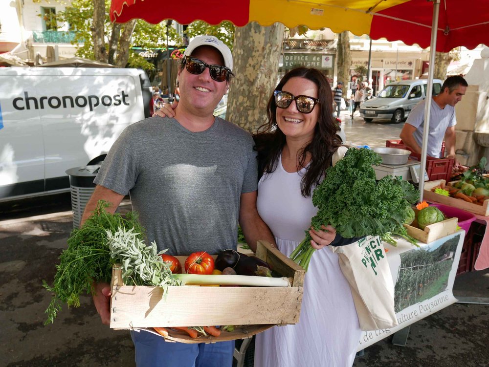  Our friends Leah and Mike buying provisions at Vence’s farmers’ market for our evening’s feast. 