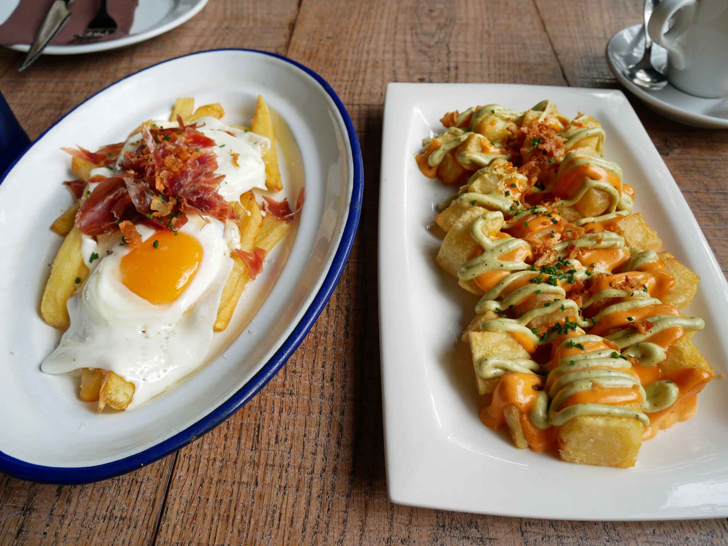  First thing we did when we arrived in Barcelona was head for  patatas bravas  and  fried egg with jam  ón  at Bodega Granados (Sept 18). 