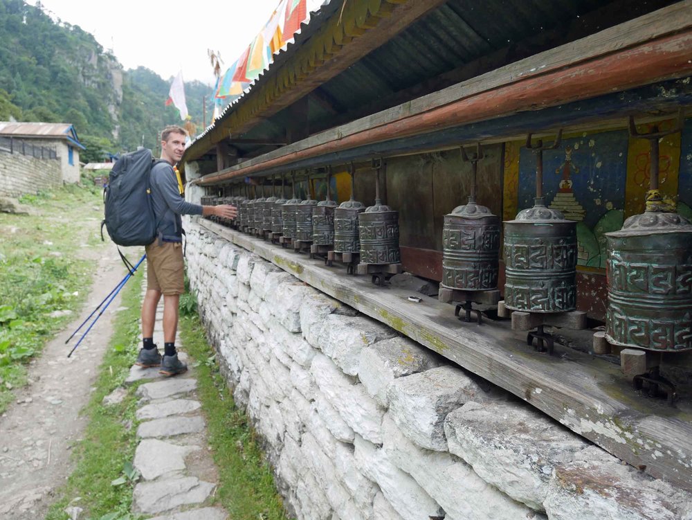  Trey giving the Tibetan Buddhist prayer wheels a spin (his first of many!) on our way out of Tal. 