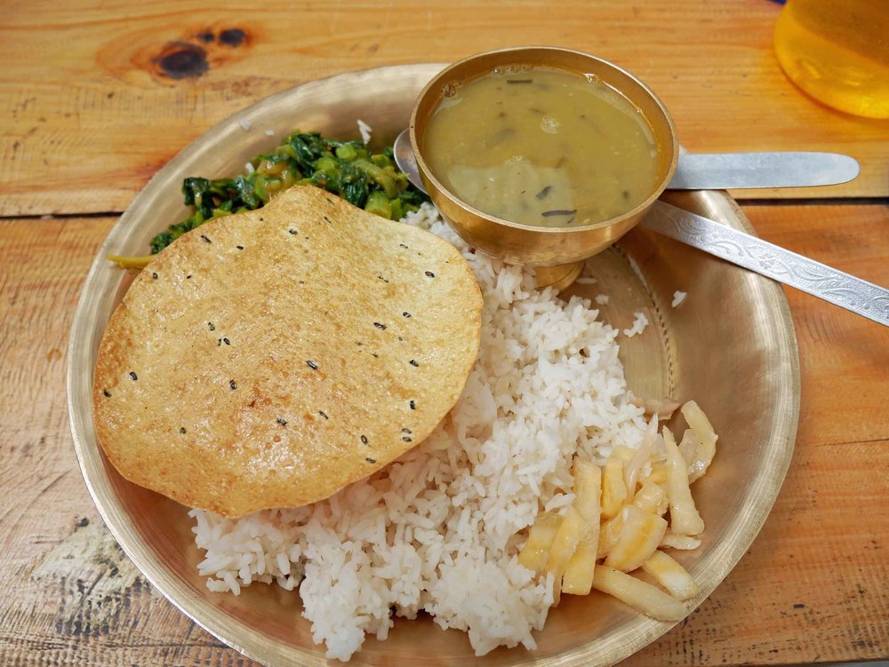  Our daily  dal bhat  – each guesthouse has their own take on the intentionally simple meal of rice and lentils.&nbsp; 