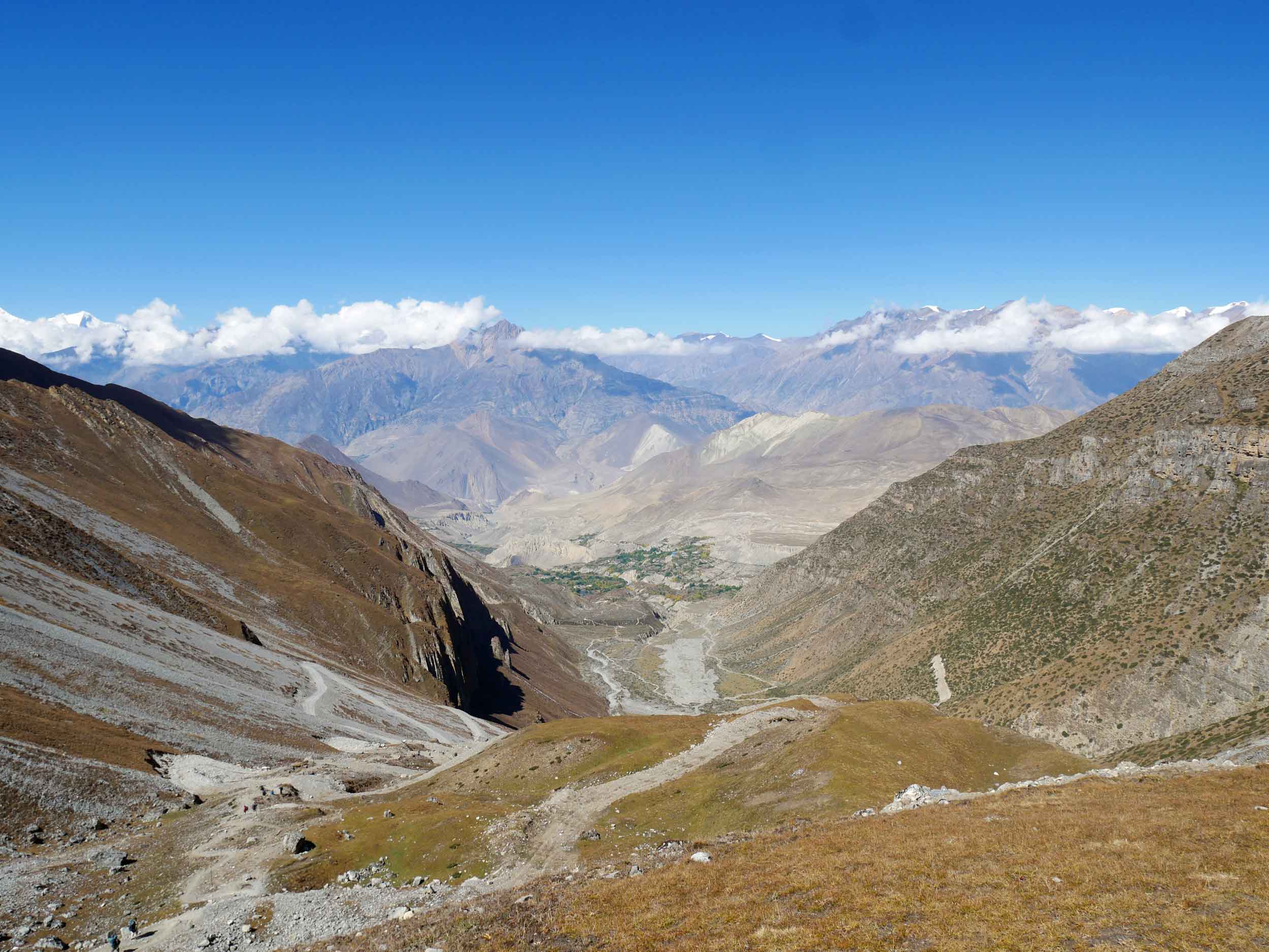 And dooooown we must go! 1,700 metres of monotonous, switch backs in fact… to that small village in the distance amidst the green.