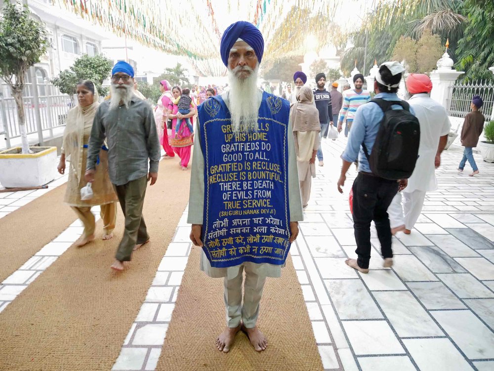  In the comings and goings of thousands of pilgrims, this man requested we take a photo of his message. 