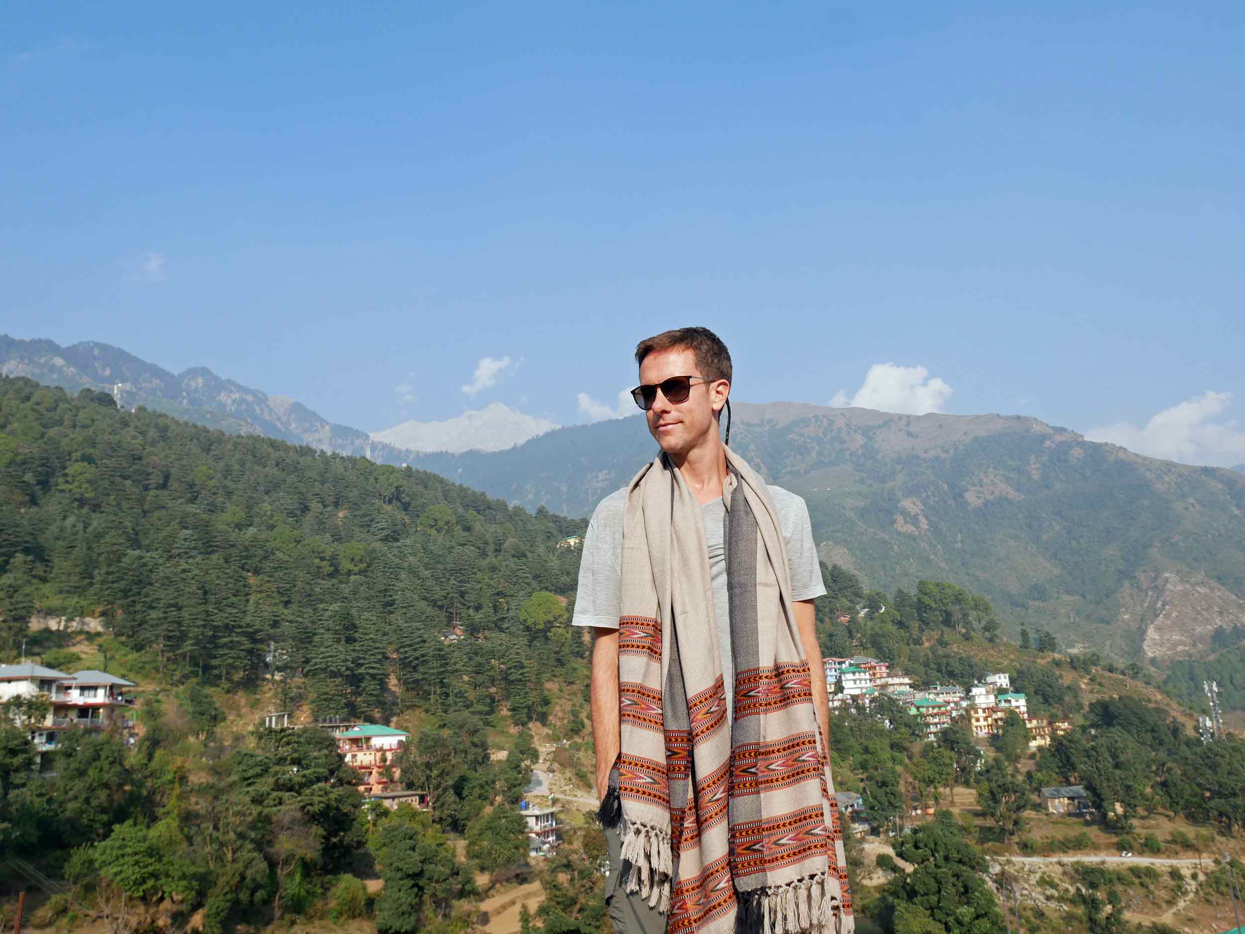  Martin wearing a Tibetan shawl and taking in the sunshine on our roof deck, overlooking the Buddhist village in the Himalayas. 