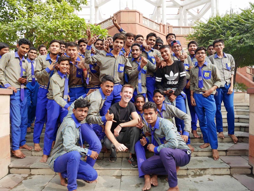  Used to all the picture requests by now, Trey makes friends while visiting Delhi's Hare Krishna Temple. 