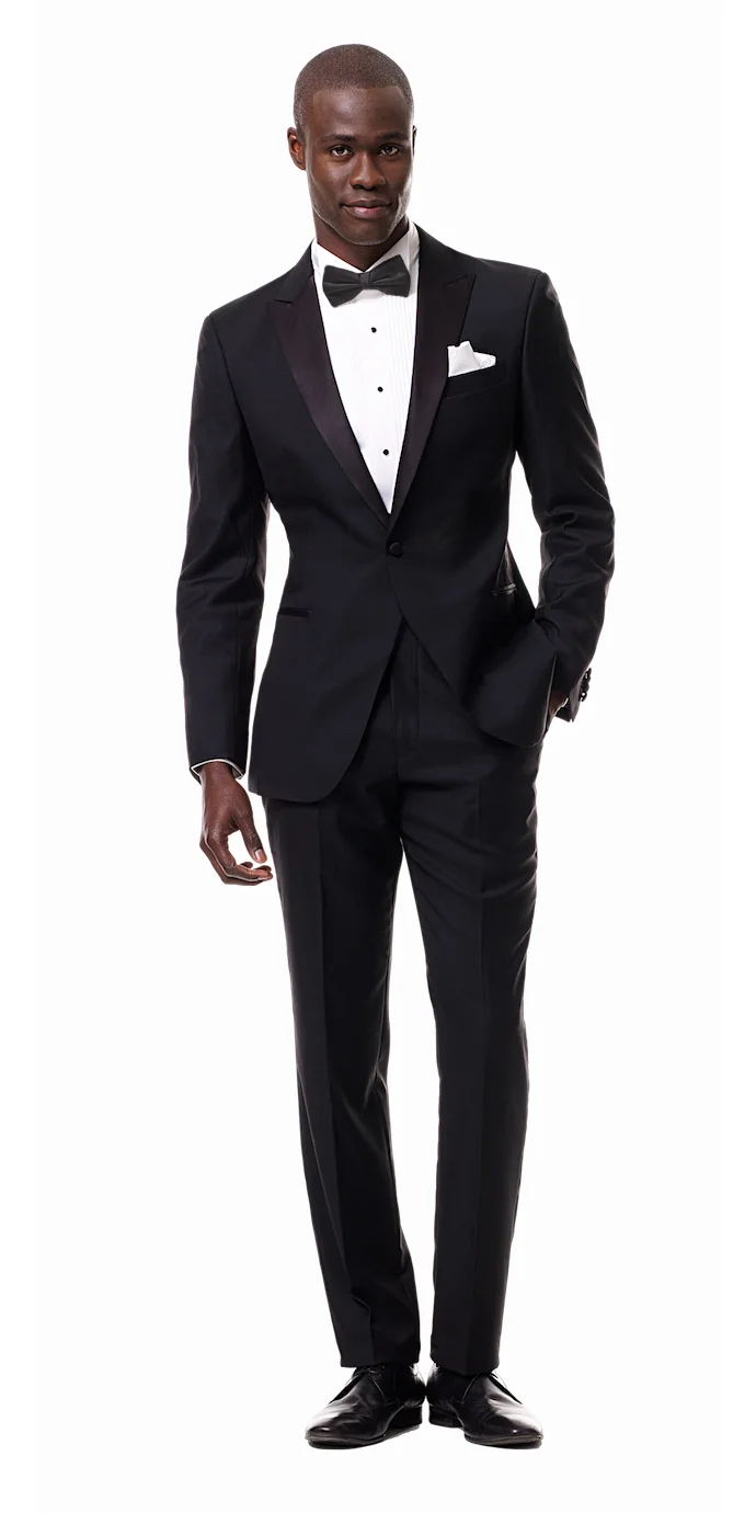 Black Custom Tuxedo with Peak Lapel The gold standard in formalwear, a black tuxedo with peak lapels is as classic as they come...They’re great for weddings but don’t keep this one locked away as solely a wedding tux. - © Black Lapel
