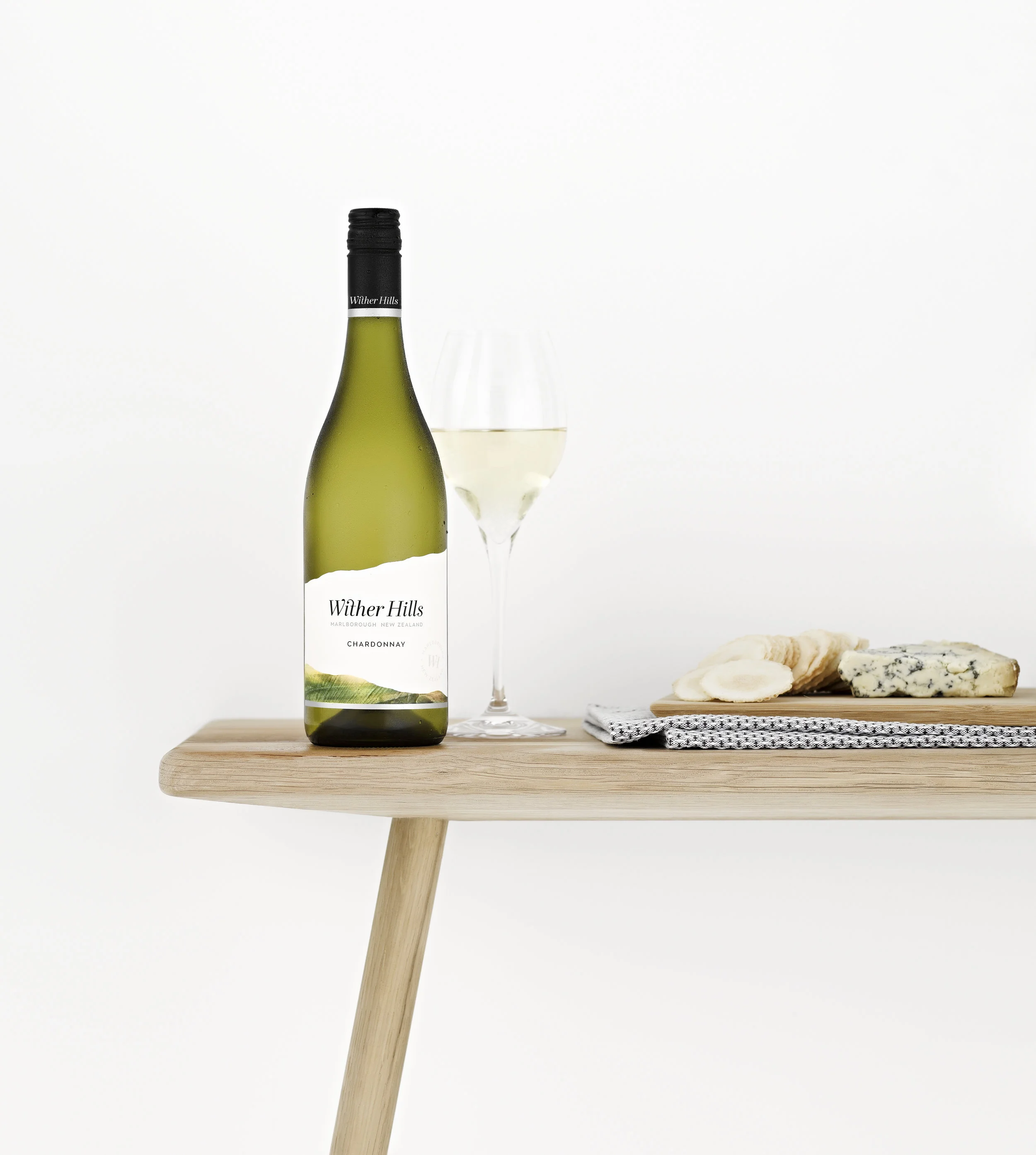 WitherHills_Chardonnay_Steamed_WoodenTable_Food_Flat_NV.jpg