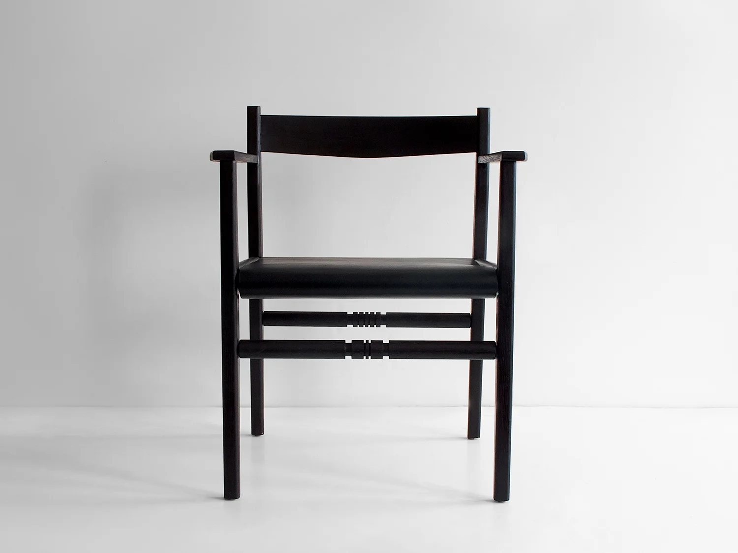 Ebonized ash, black saddle leather