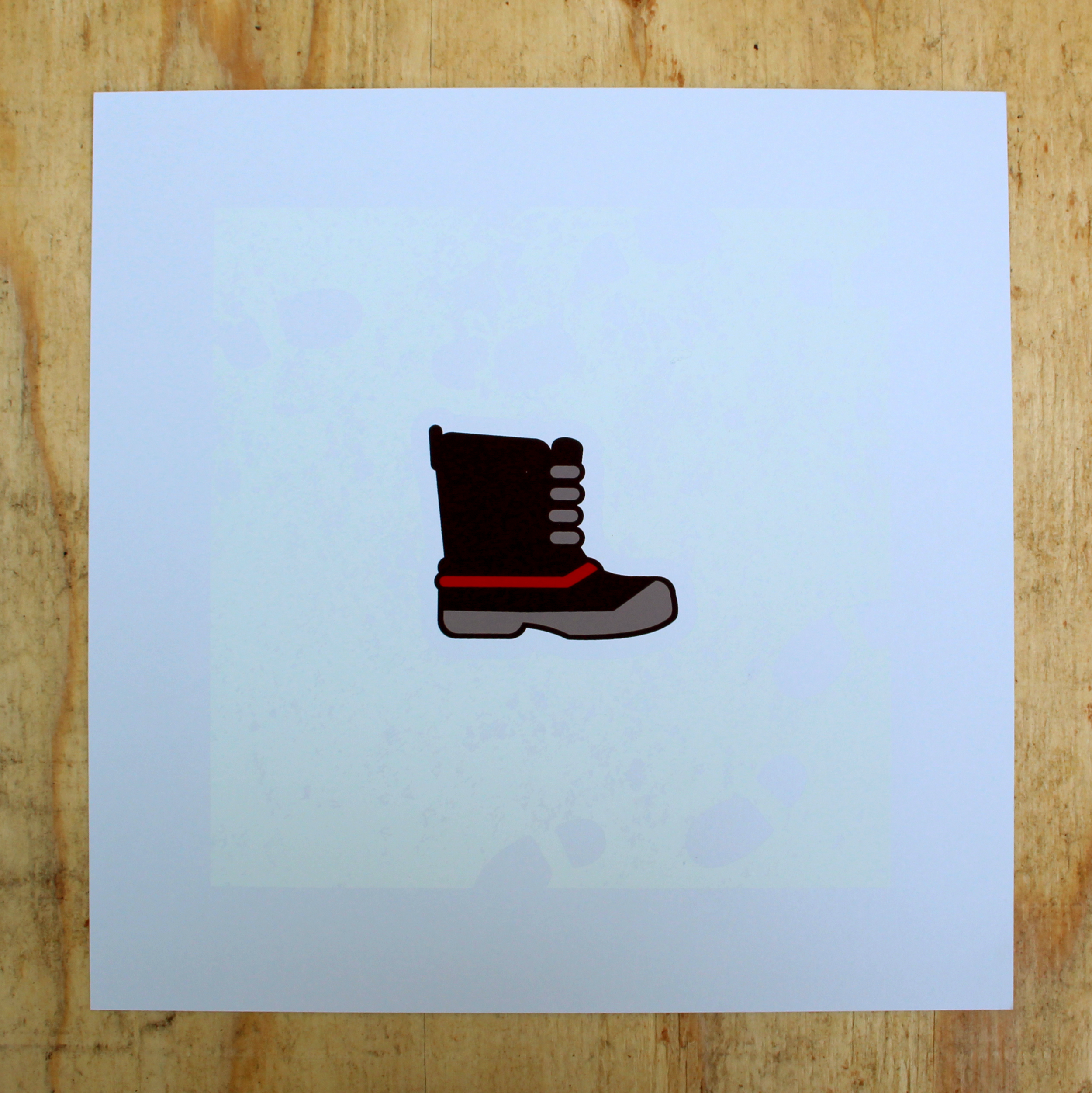 Photo of a square, 4-color screen print of a winter pack boot on top of a faint white background showing footprints in the snow.