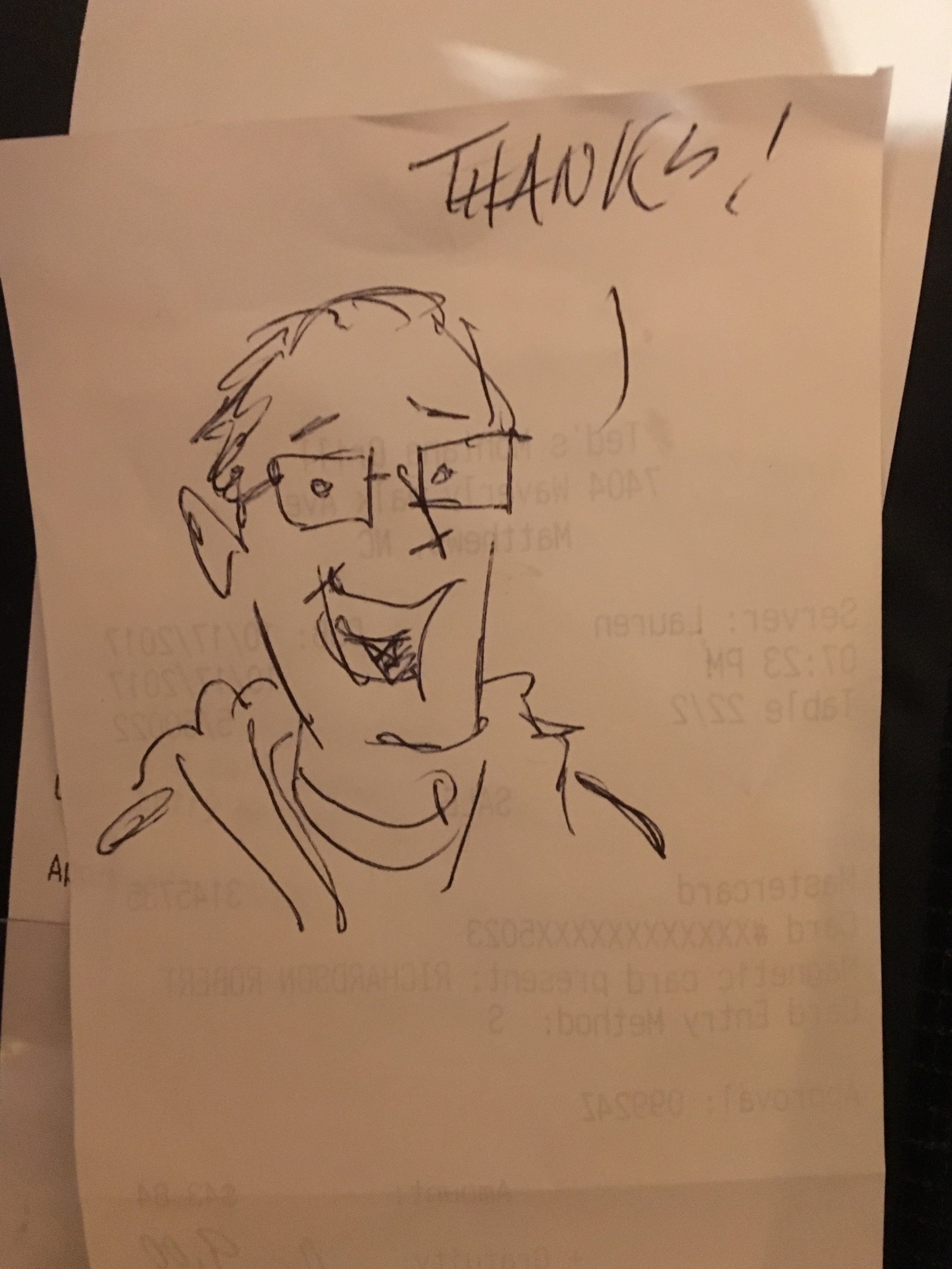 A guy drew this self portrait on the back of the receipt for me.