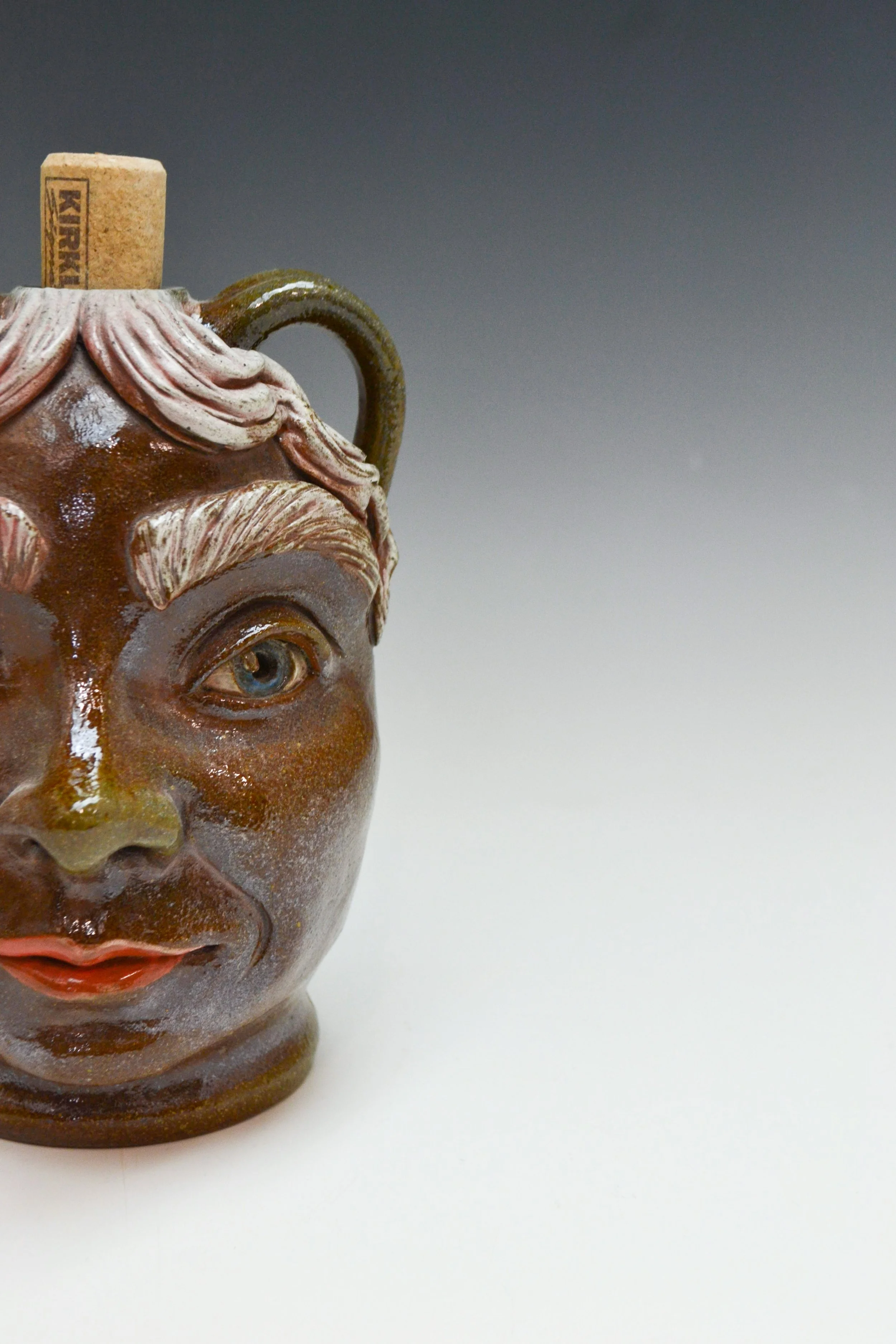 Megan160-SmallSodaFiredFaceJug-2.jpg