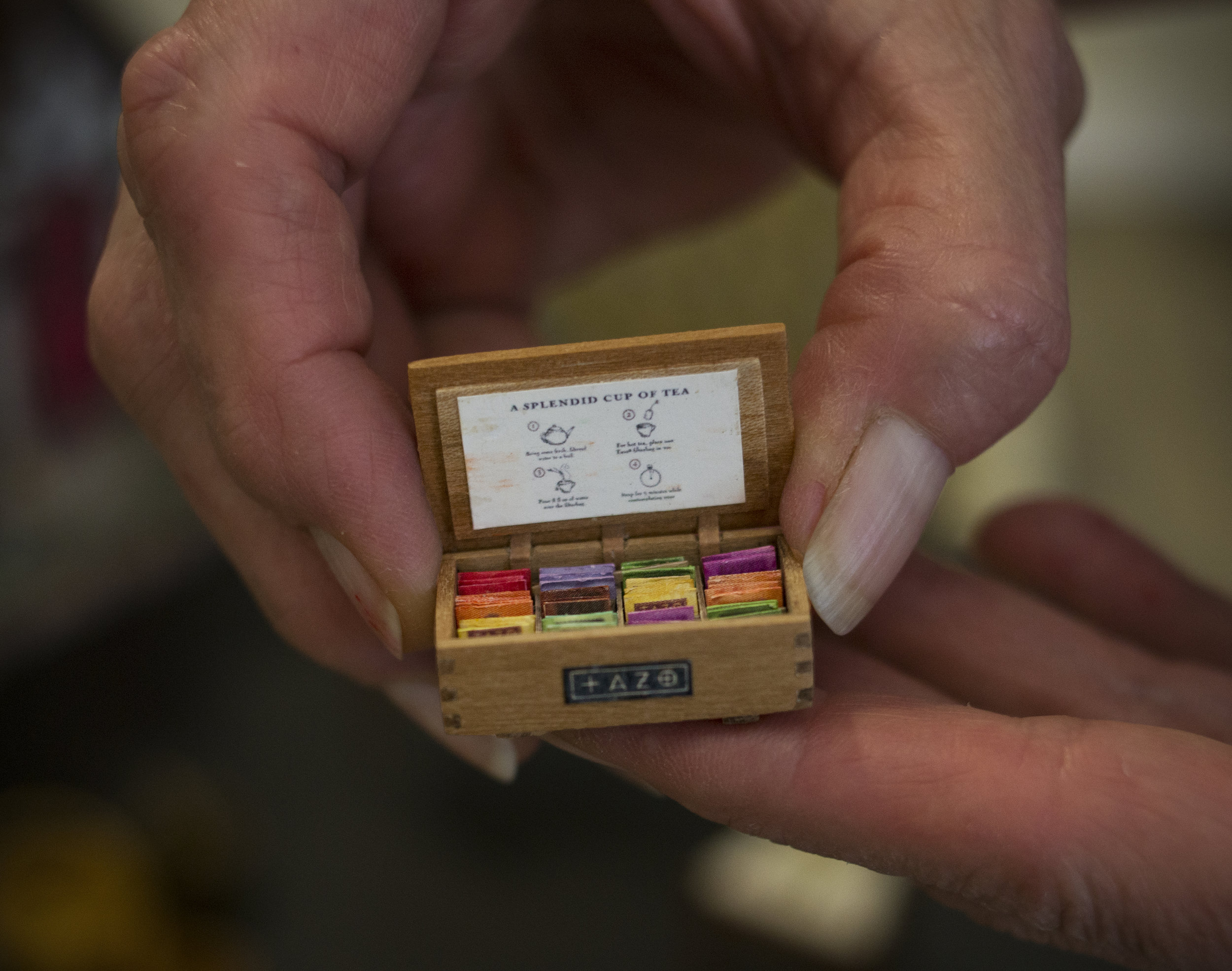  Diane Scott holds her mini box of Tazo teas, a tea made popular by Starbucks Coffee. (Rhianna Gelhart/The Register-Guard) 