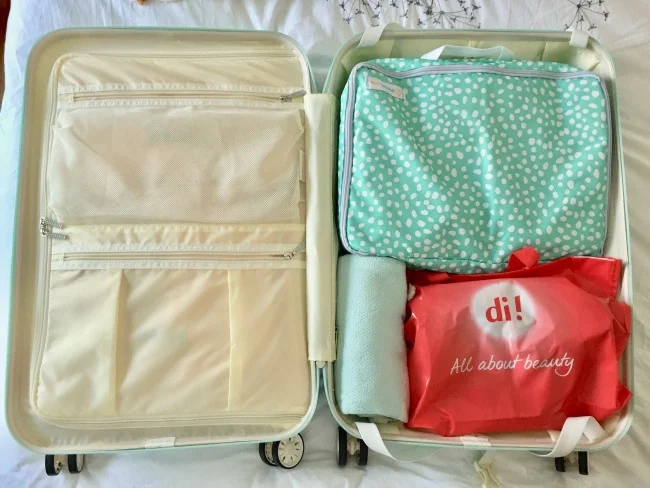 Jules and Louis Blog - How to pack for vacation - inside my suitcase Suit Suit.jpg