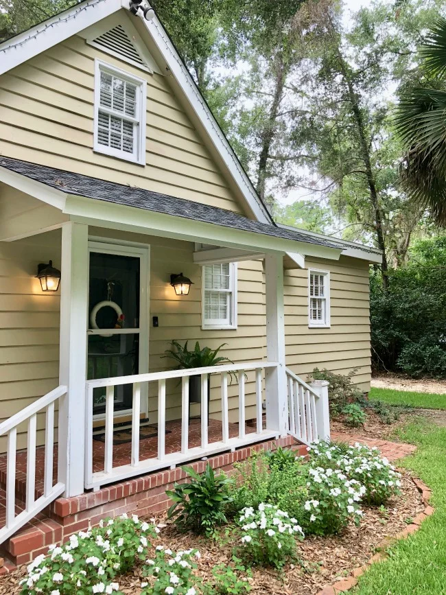 Jules and Louis Blog - A cute adorable home in Tallahassee - the front of the house with porch and stairs.jpg