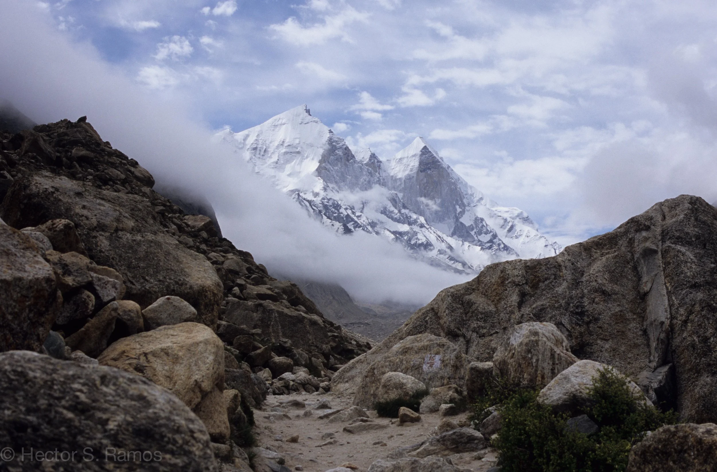 Bhagirathi Peaks in Gangotri area. Considered the source of the sacred river Ganga. We just folded our tents and commenced on our trek when the clouds and fog cleared. Photo: Leica MP, 35mm Summilux, Velvia 50 on a monopod.