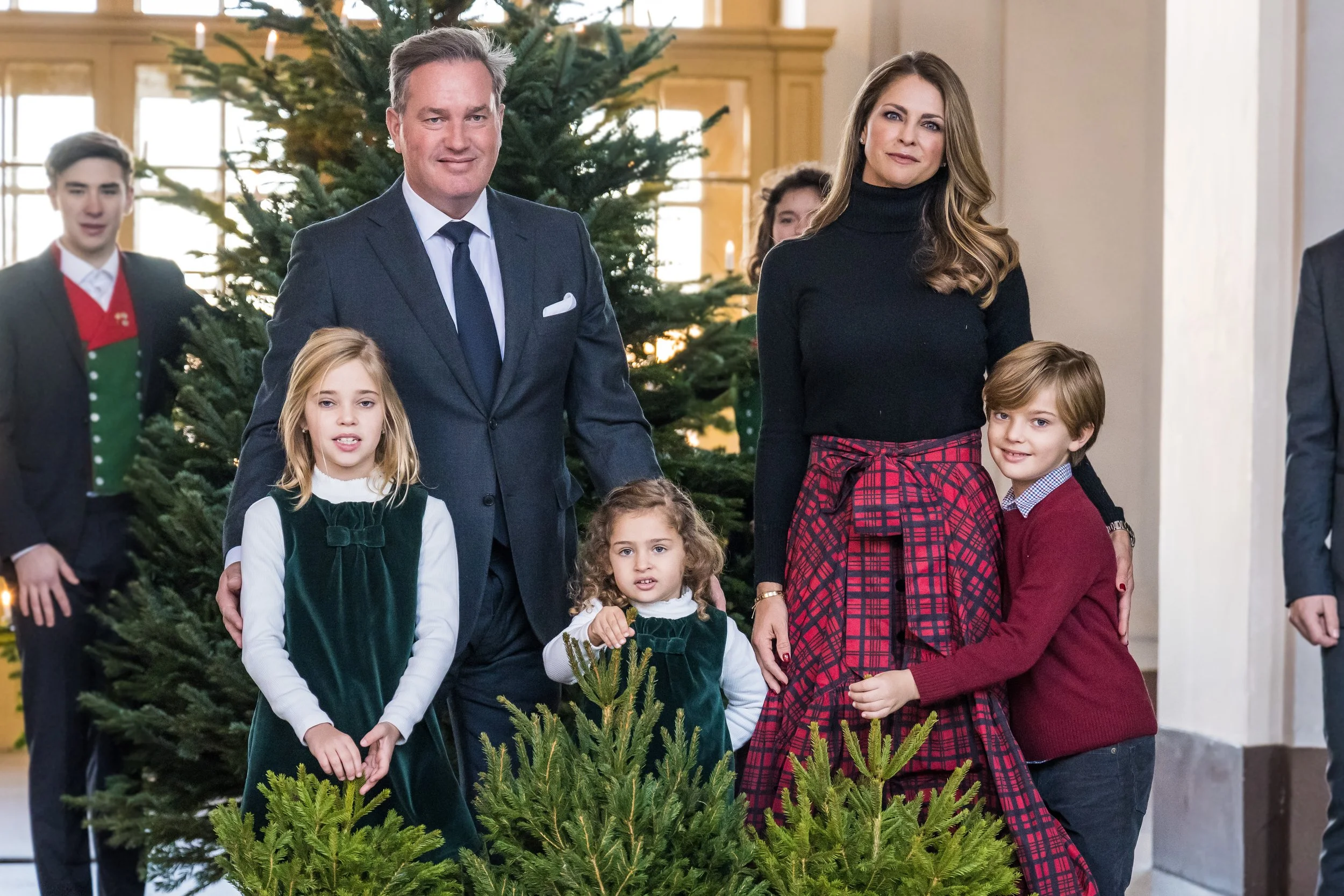 Princess Madeleine, Chris O'Neill, and their children receive Christmas trees at the Palace