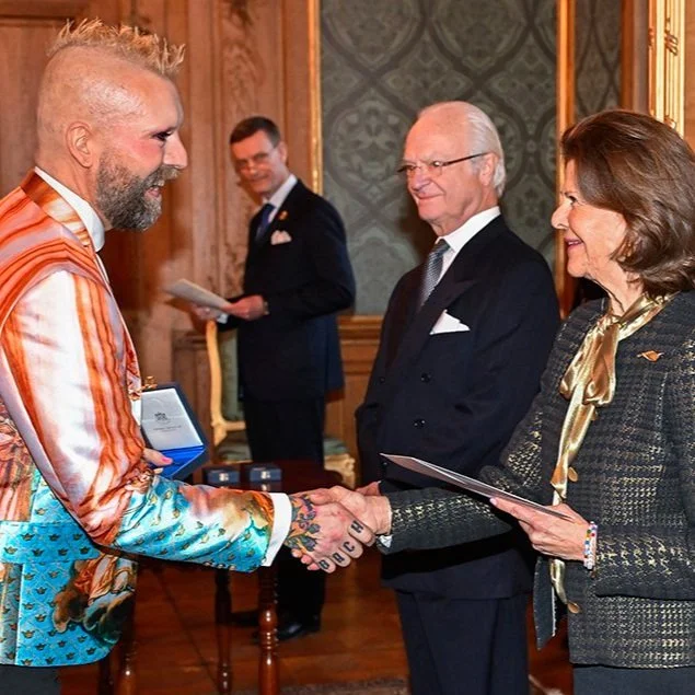 King Carl-Gustaf and Queen Silvia present medals at the Royal Palace