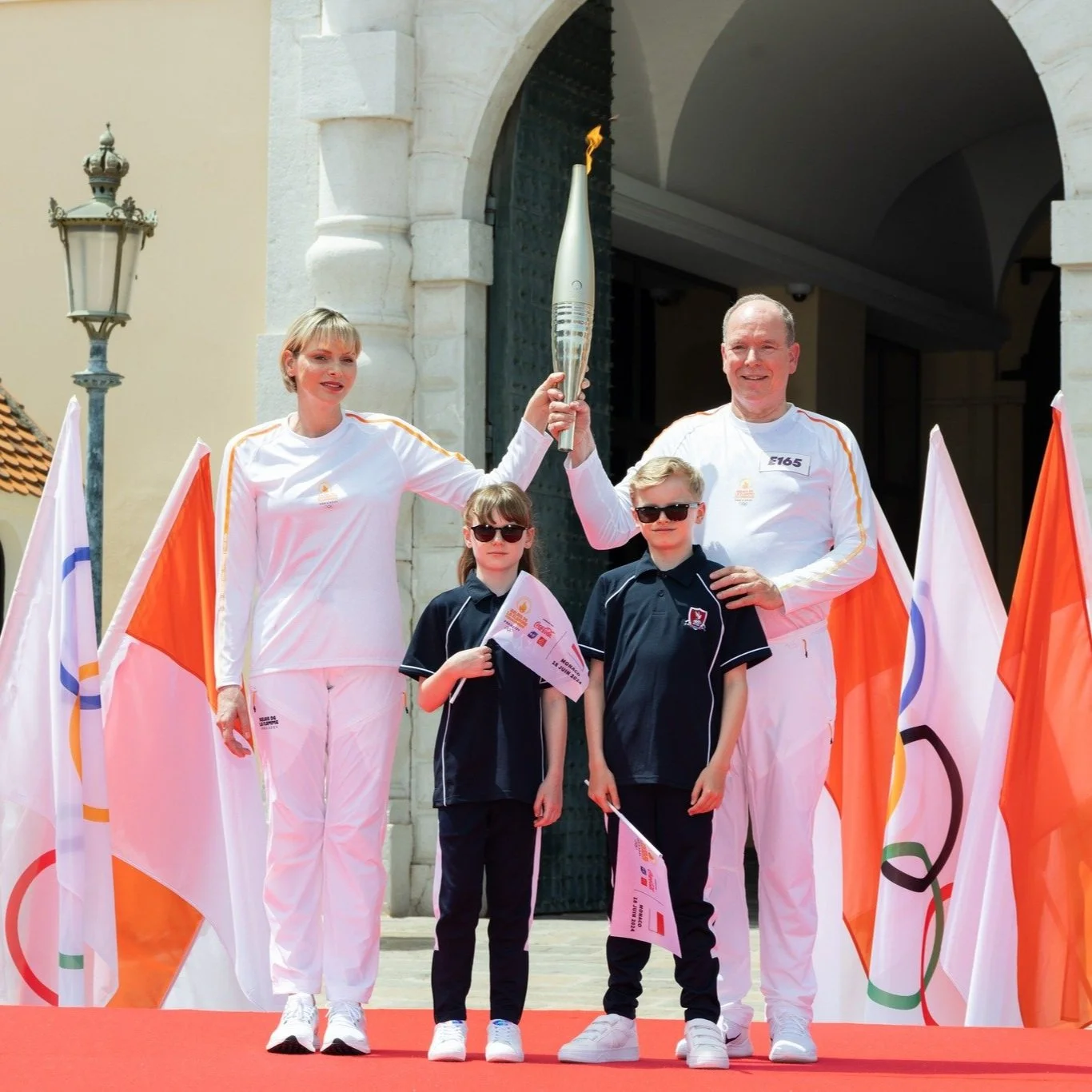 Prince Albert and Princess Charlene take part in Olympic Torch relay