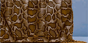 Uterque Snakeskin Flap Clutch.webp