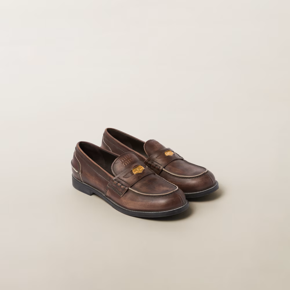 Miu Miu Vintage-Effect Leather Penny Loafers in Ebony.png