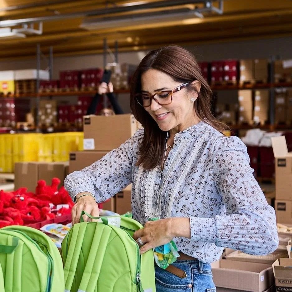 Queen Mary packs backpacks for children in shelters