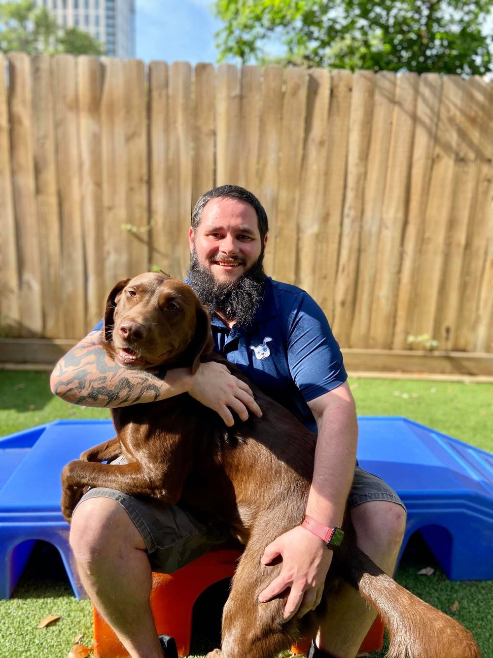 Wag'n World employee caring for a dog