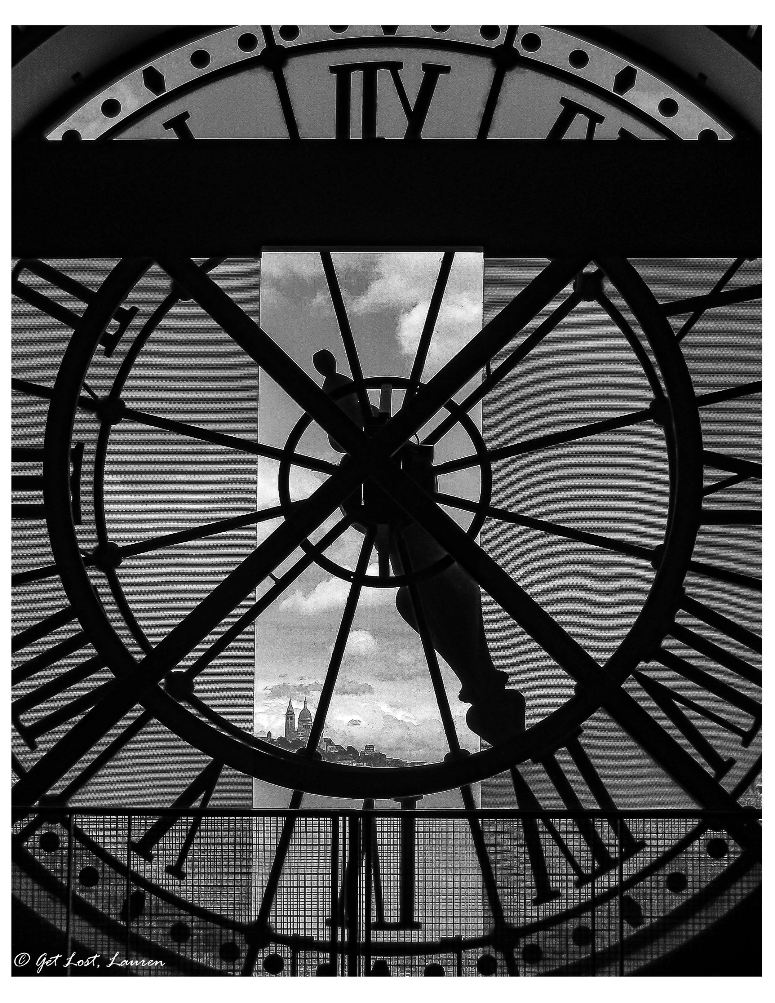 The Sacre Coeur peeking through the clock at the Orsay.