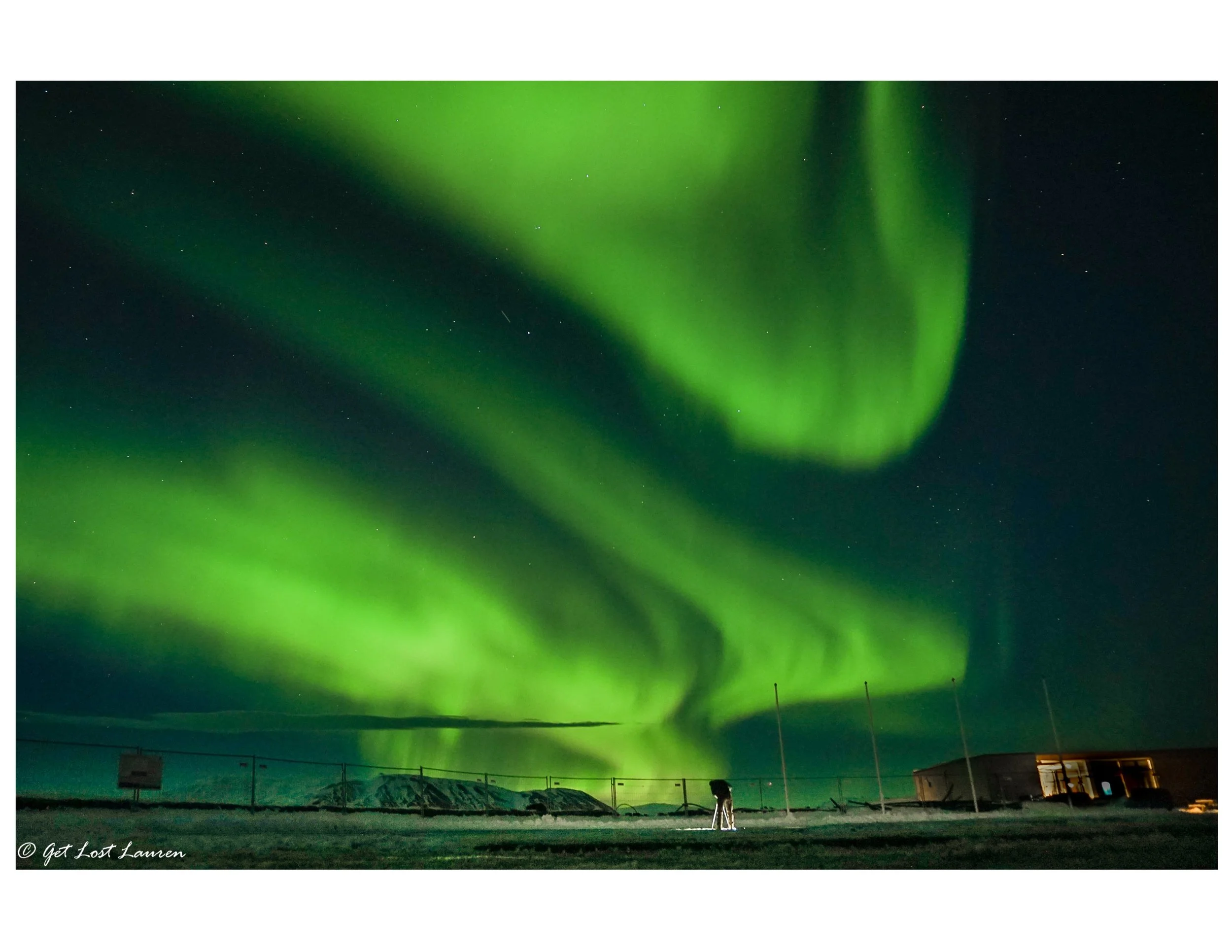 Setting up a shot in the parking lot at Þingvellir National Park under the dancing Aurora. Sony a5000. f4/ISO 800/4"