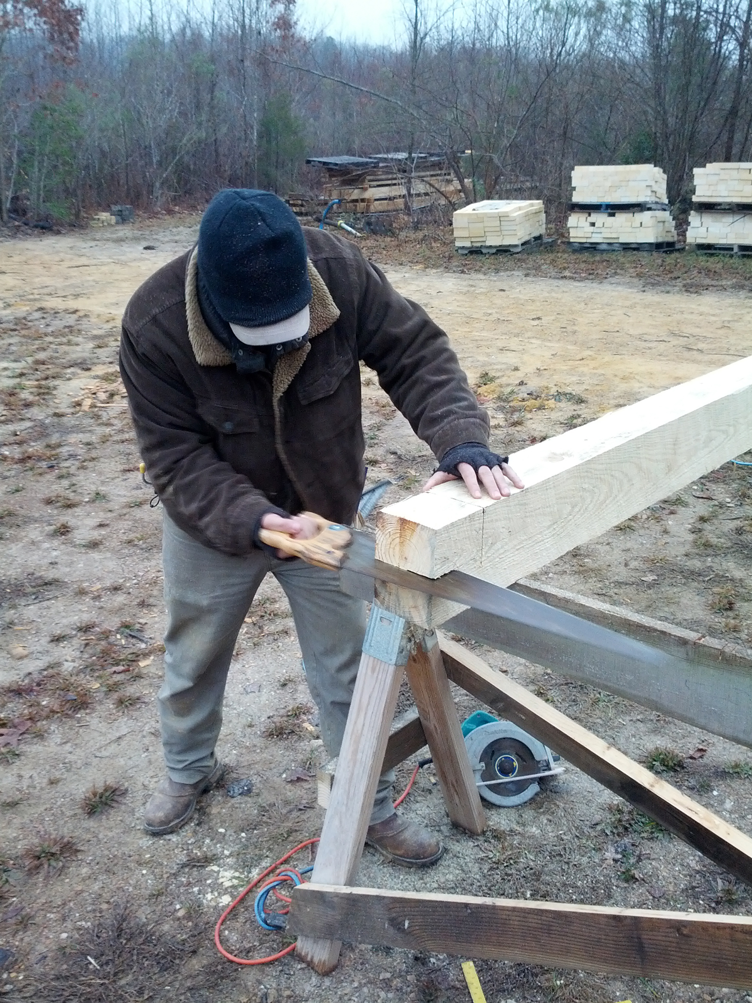 I had to finish every log by hand. The tools we use today aren't really designed for the large timber I was using, like this is 5" x 7". 