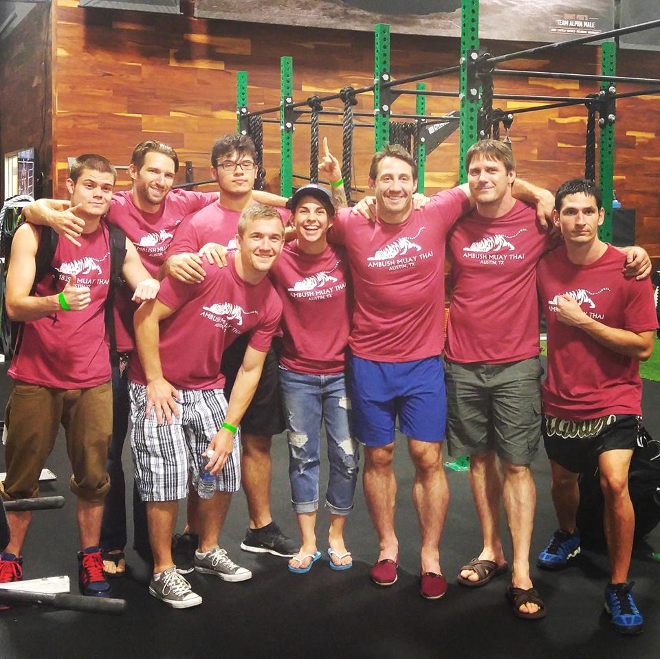 Ambush Muay Thai teammates Spencer Hanley, Sean McKiernan, Jack Hawkins, Paul Gonzales, Jenna Crank, Tim Kennedy, Coach Elton Wells, and Buddy Chambers.