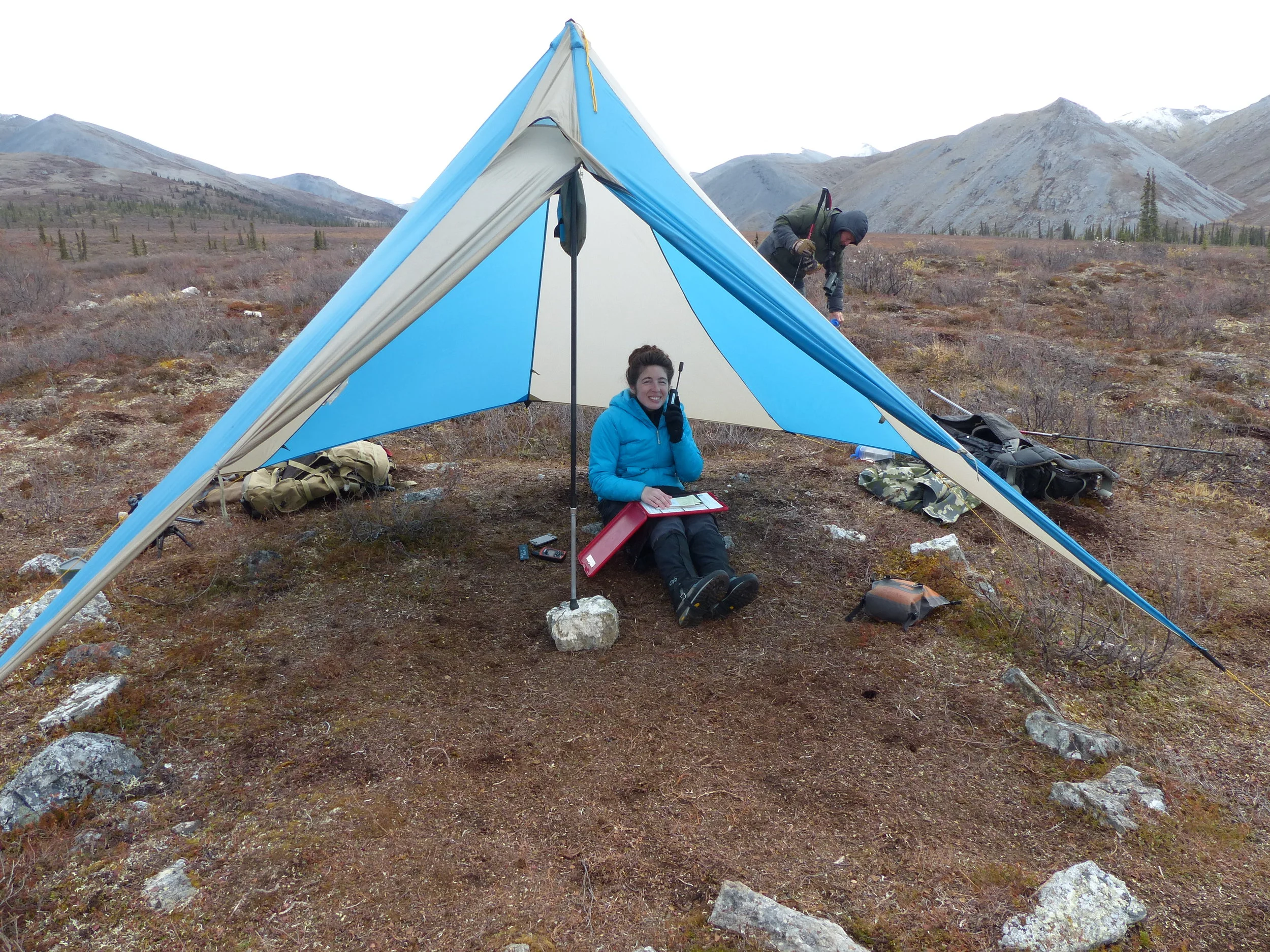 Alexandra takes shelter from the wind while she tries to run logistics; Fall 2016