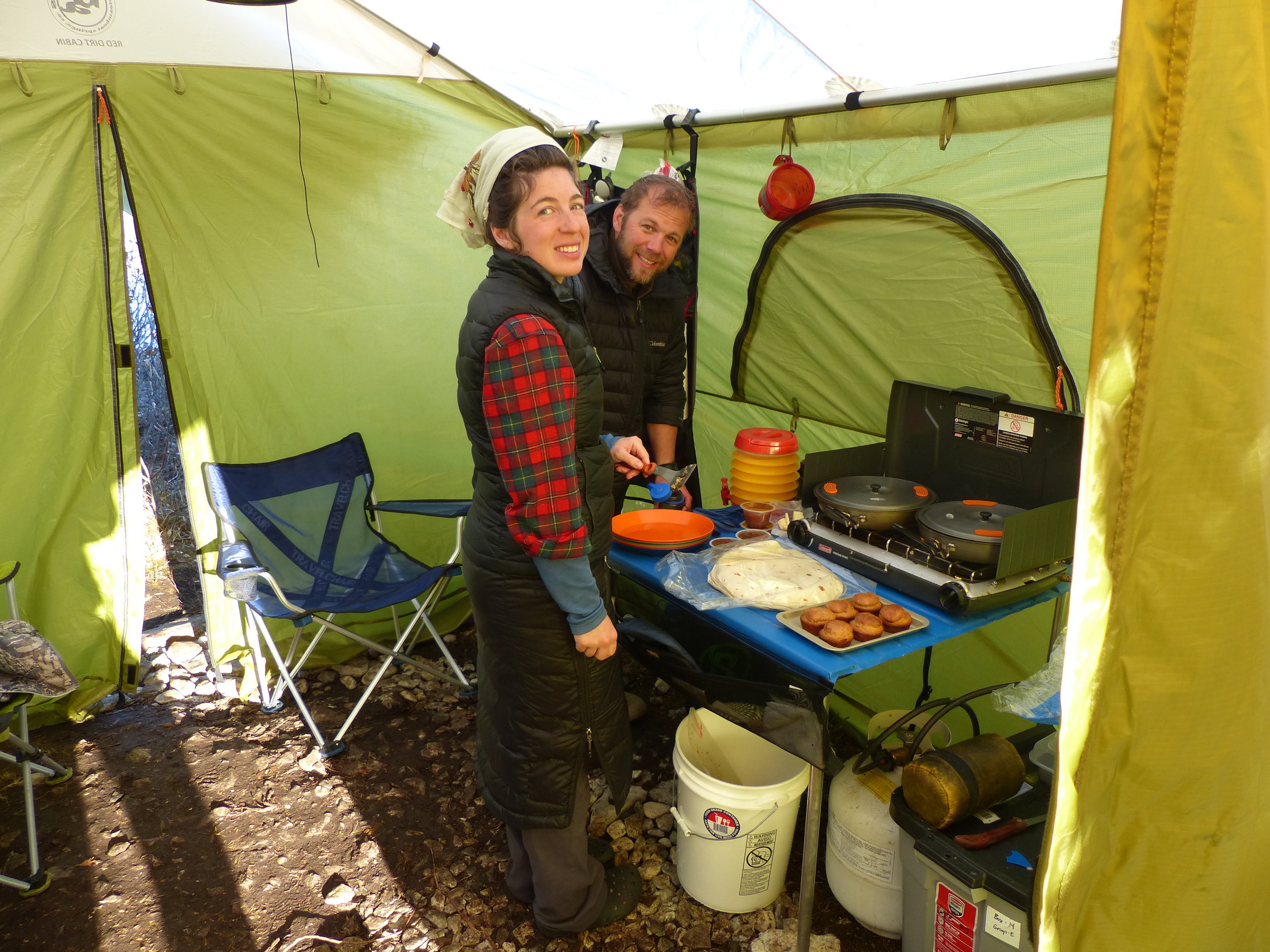 Alexandra and Nate prepare breakfast in the cook tent