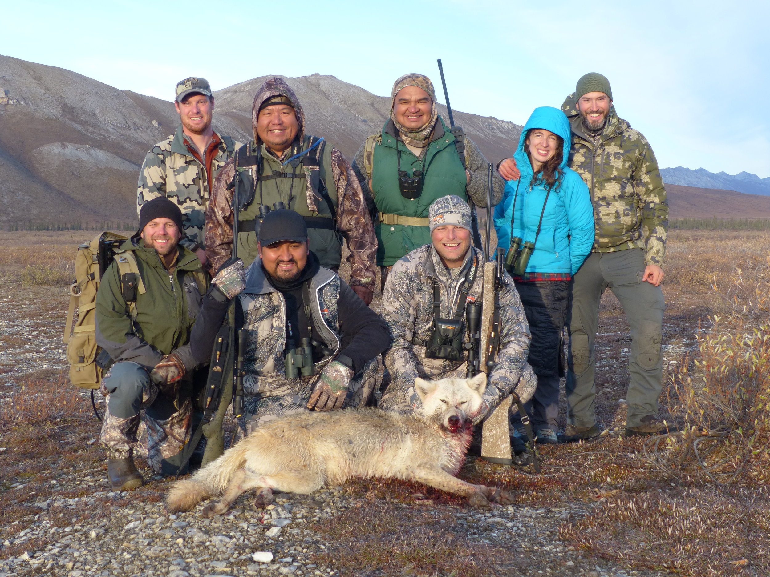 The group at camp with the first wolf of the season. Front row (from L-R): Nate, our packer; Kanim; Scott Back row (from L-R): Jeff, our guide; Randy; Pat; Alexandra and Lyle, owner and outfitter