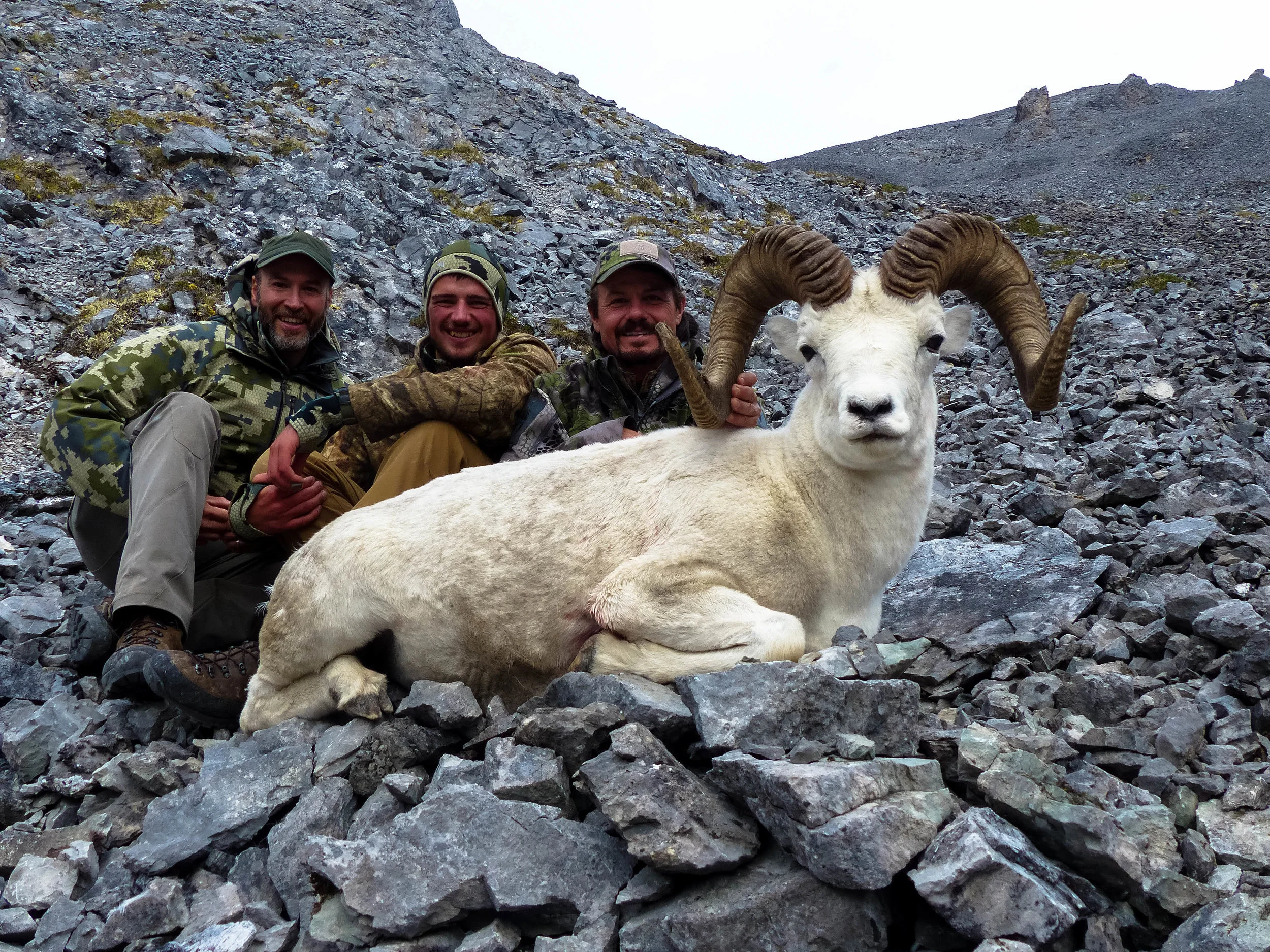Owner and outfitter Lyle (left), packer Hunter (center), and James Reed (left) with James' ram, Brooks Range; Fall 2018