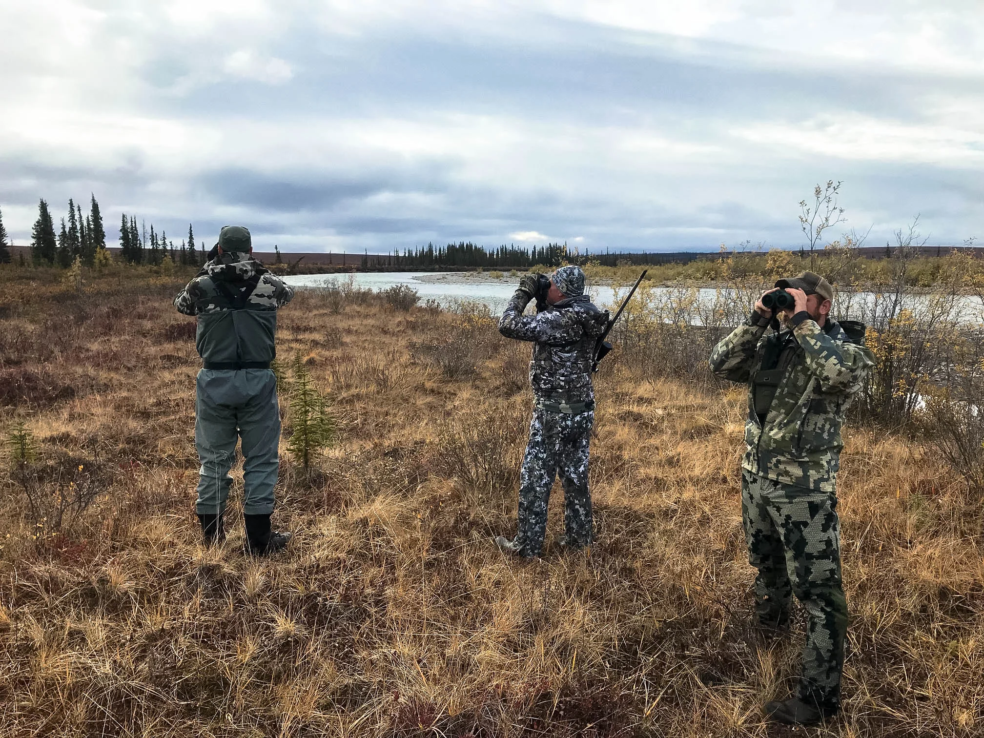 Owner and Outfitter Lyle (left), hunter Chuck, and packer Chris glass for game; Fall 2018