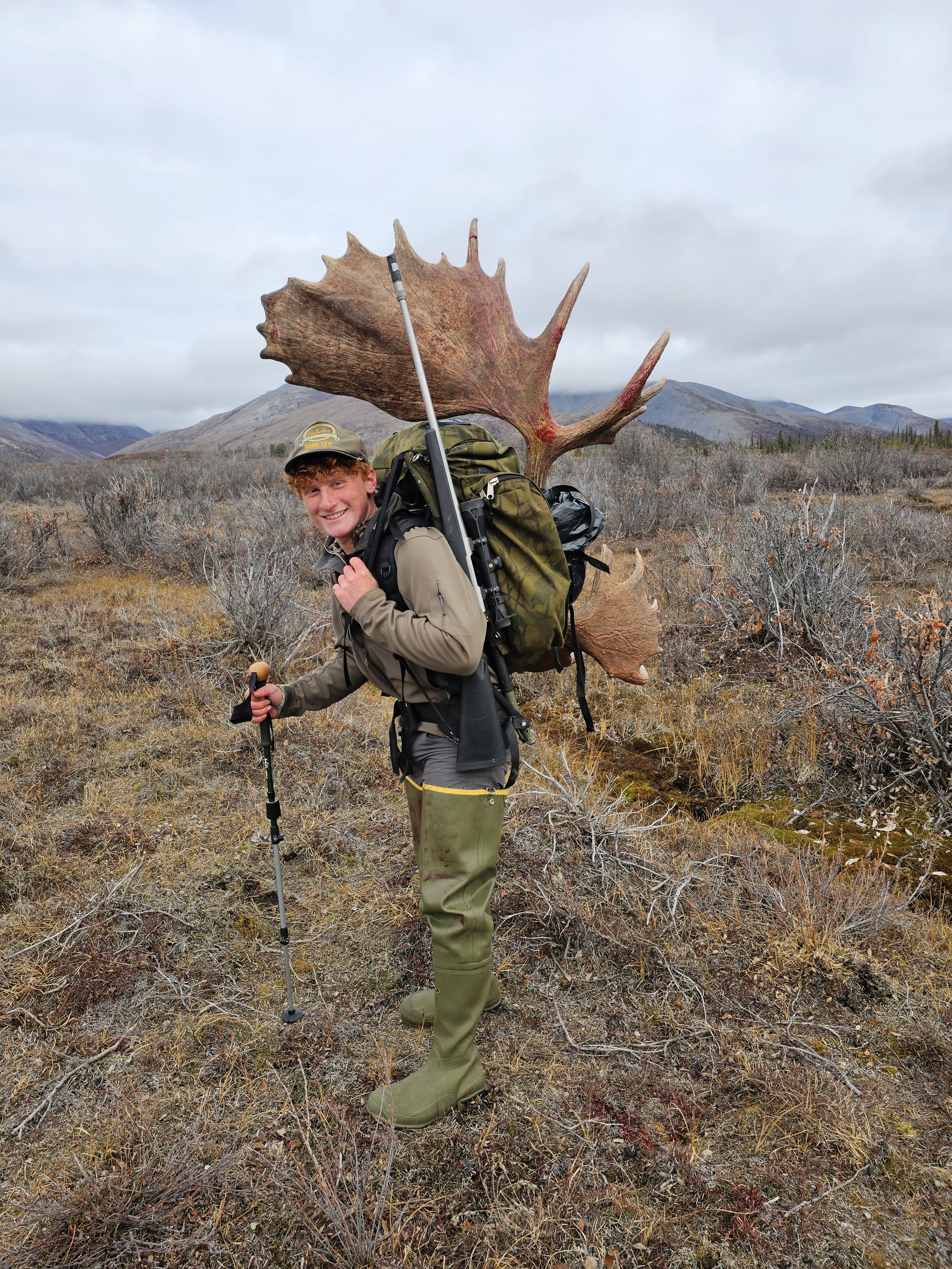 Packer Aiden L. carrying out some moose antlers