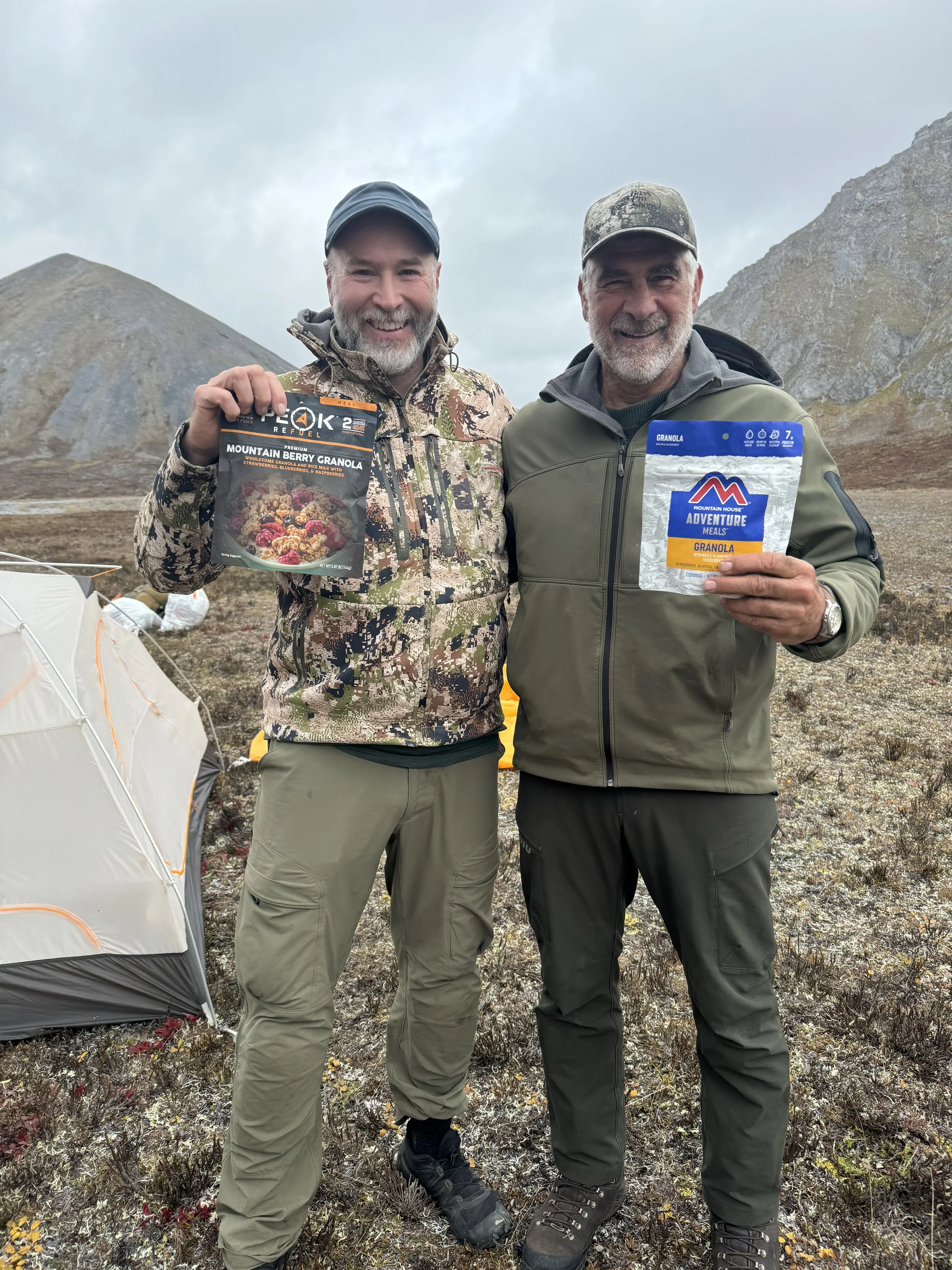Guide Lyle B. (l) and hunter Leonard D. share a freeze dried breakfast on a special anniversary