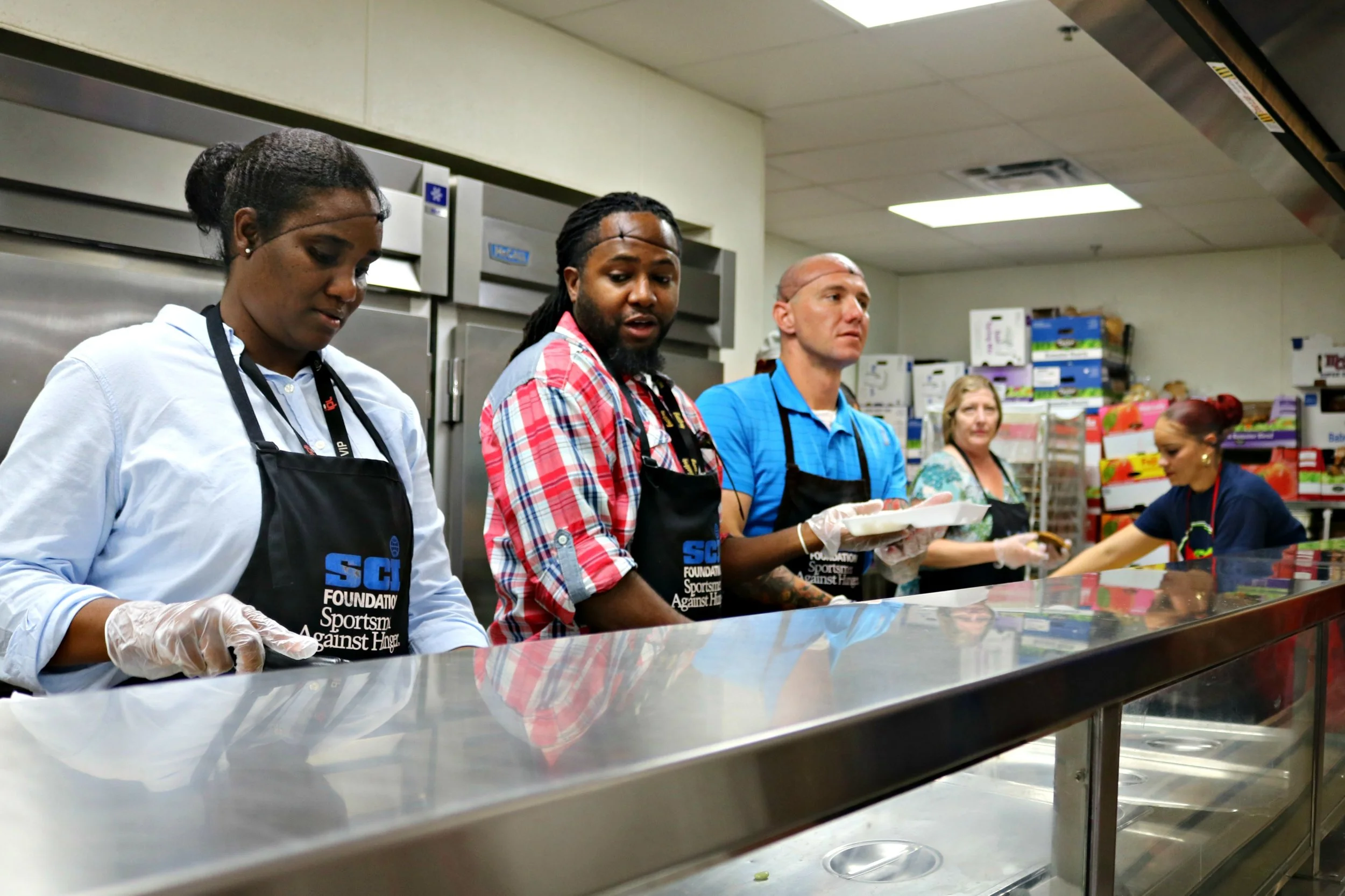 Well Care Staff getting ready to serve up to 1000 people 