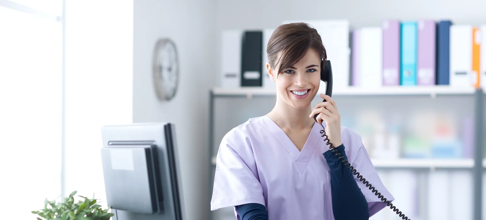 bigstock-Smiling-Receptionist-At-The-Cl-136924850 (1).jpg