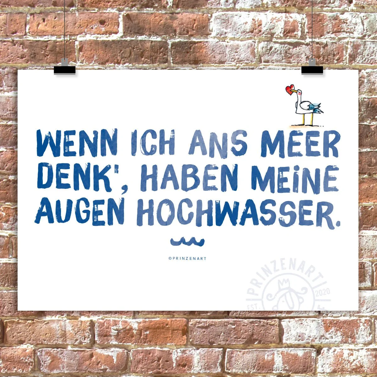 weißes Poster mit blauer Schrift an Clips, Spruch: Wenn ich ans Meer denk ...