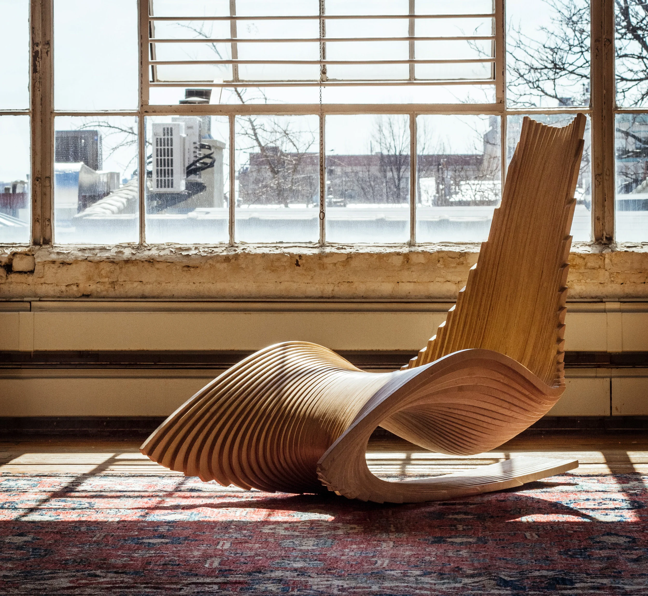 Ahmed El Husseiny/AE Superlab. The Diwani Chair, 2015. Atlantic birch plywood. 42 x 31 x 53 in. Courtesy of Ahmed El Husseiny/AE Superlab. 2016.AES.01. Photo: Courtesy of Ahmed ElHusseiny/AE Superlab METHOD: CNC router, hand block sander