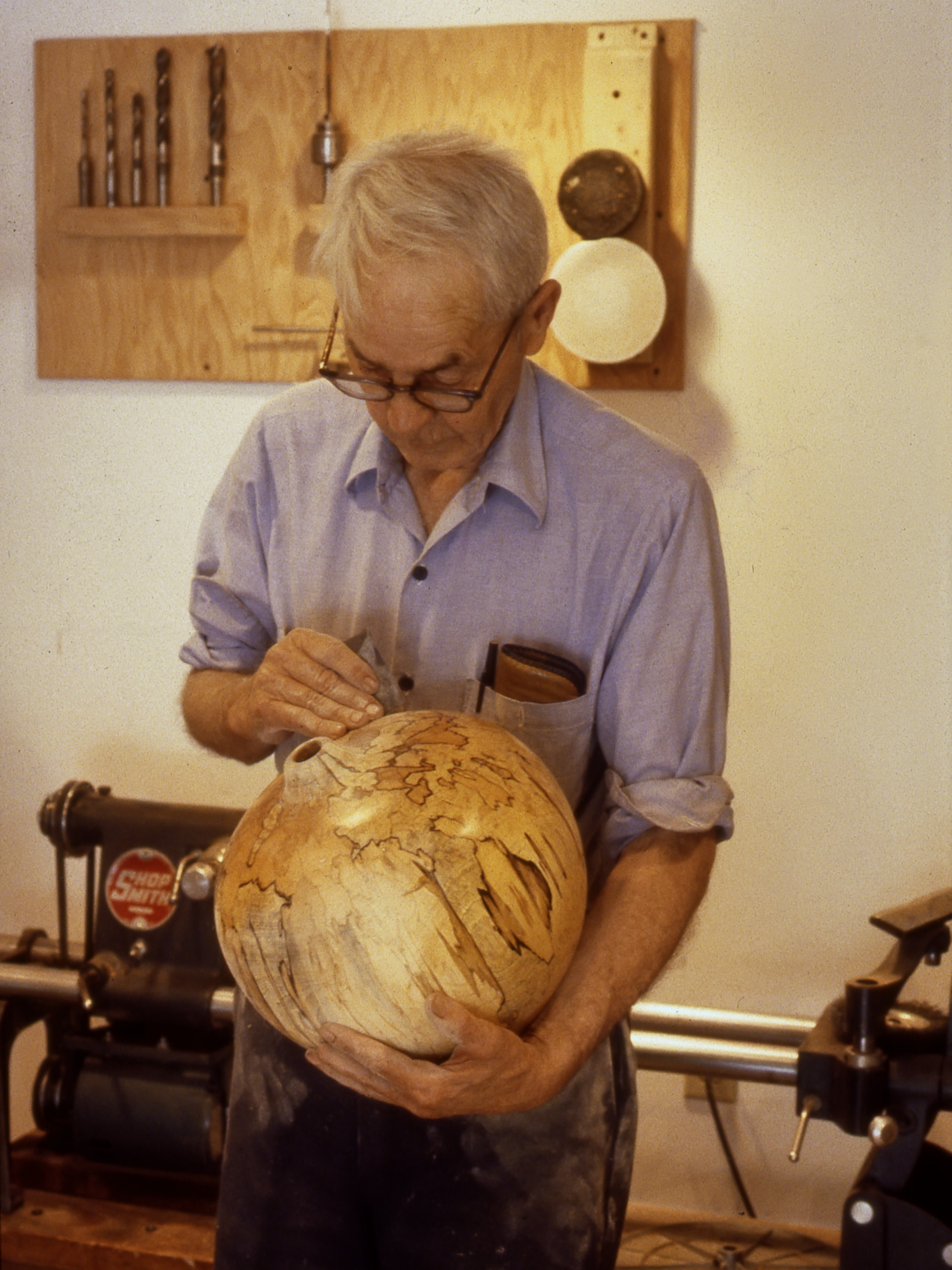 Fig. 19. Mel Lindquist hand polishes one of his spalted vessels in his Henniker, New Hampshire, studio, 1983. Photo: Lindquist Studios