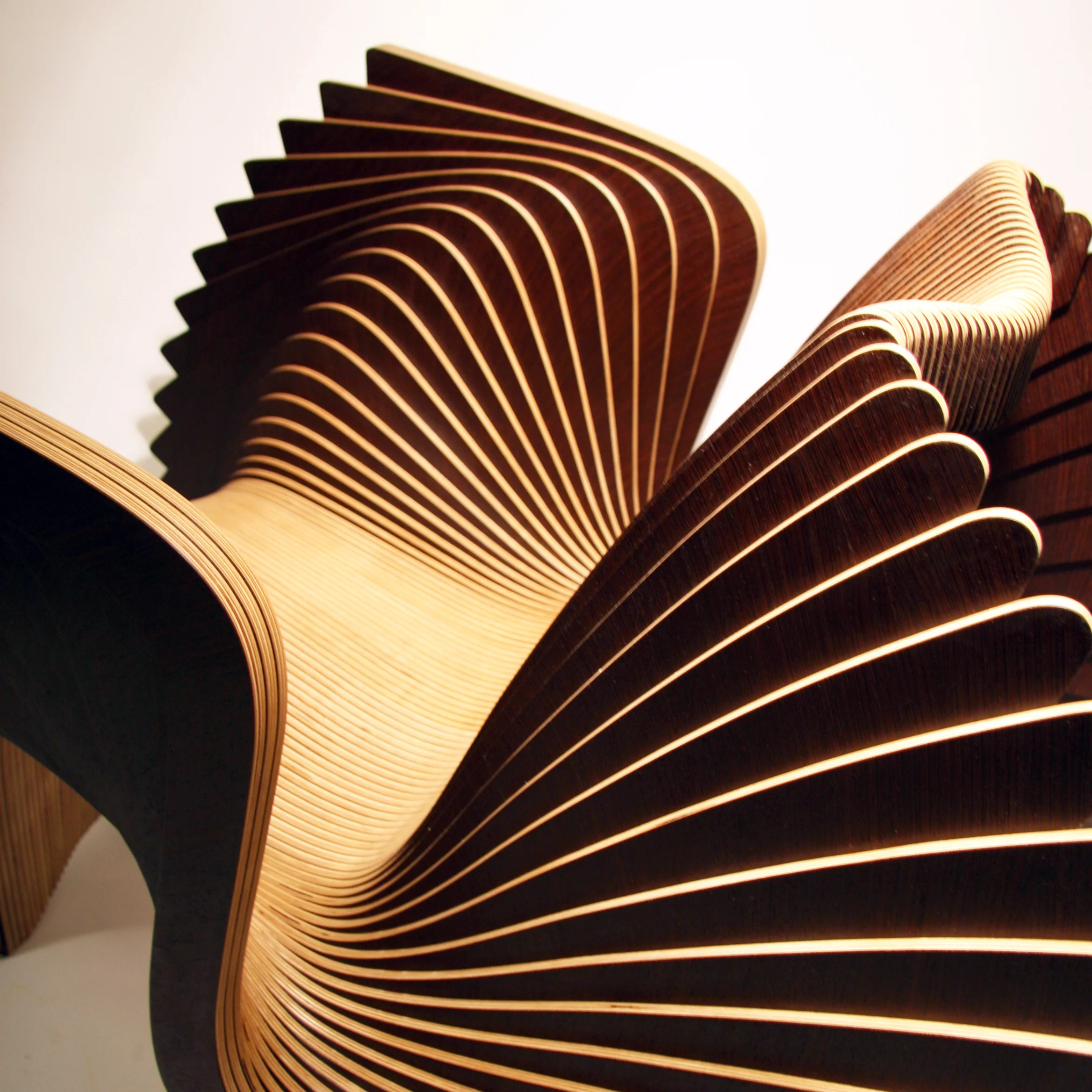Alexander White. Monroe Chair , 2016 (detail). Maple veneer, Wenge veneer, birch plywood. 32 1/2 x 46 1/2 x 32 1/2 in. Courtesy of A. White Workshop. 2016.AW.01. Photo: Courtesy of the Artist METHOD: Veneer guillotine, veneer press, CNC router, electric sander, drill, clamps