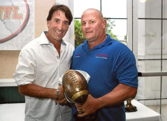 Sergio Rok with Norm McLean, commissioner of the Florida Flag Football League. Rok has been an avid player of the game for years.