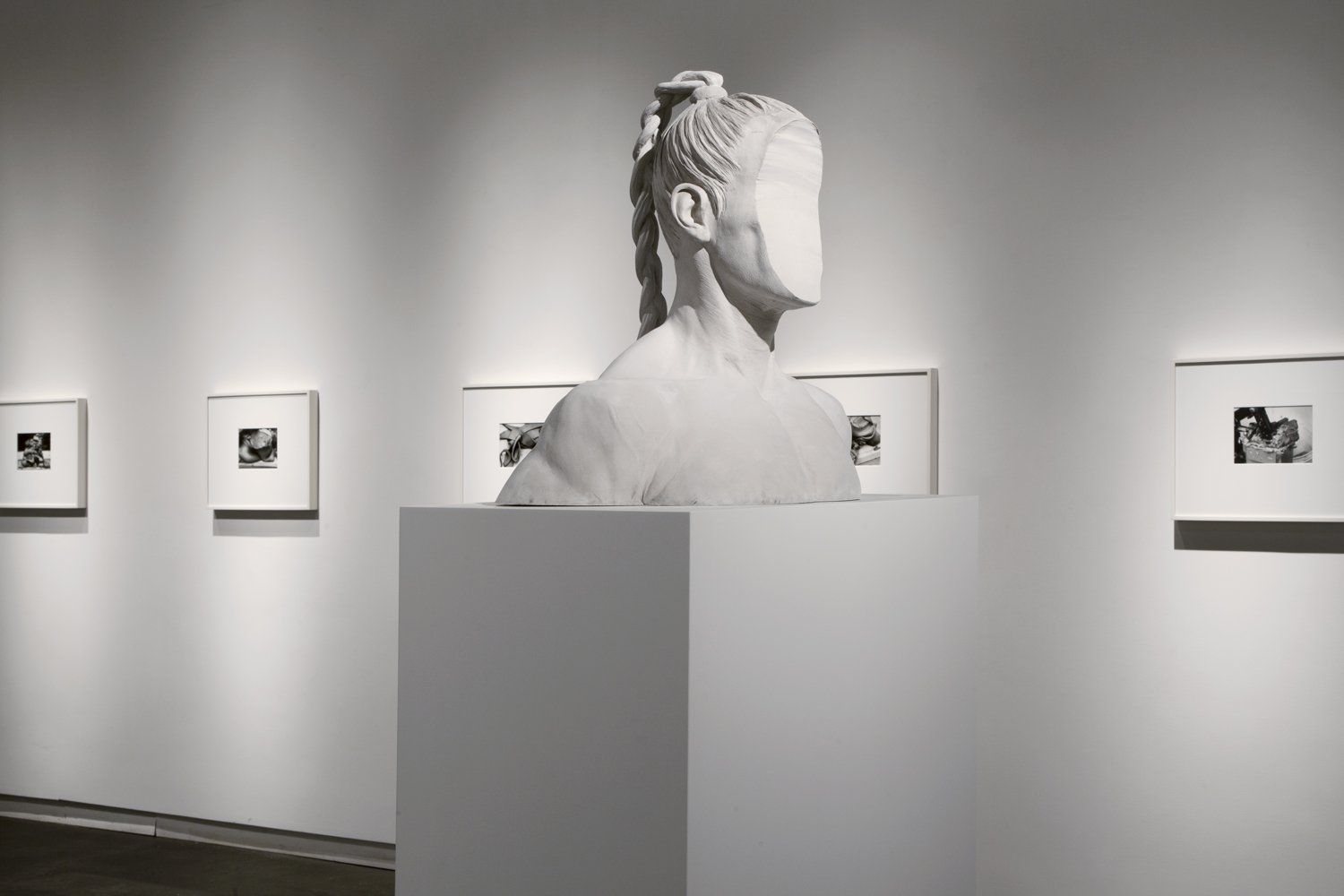   Medusa  (2013) cement, 21” x 23” x 12”   Untitled (Clay Portfolio)  (2013) gelatin silver print, 7 3/4′′ x 5 3/4′′, from a portfolio of 21 images  Installation view of  Medusa  at Daniel Faria Gallery, Toronto, Canada 